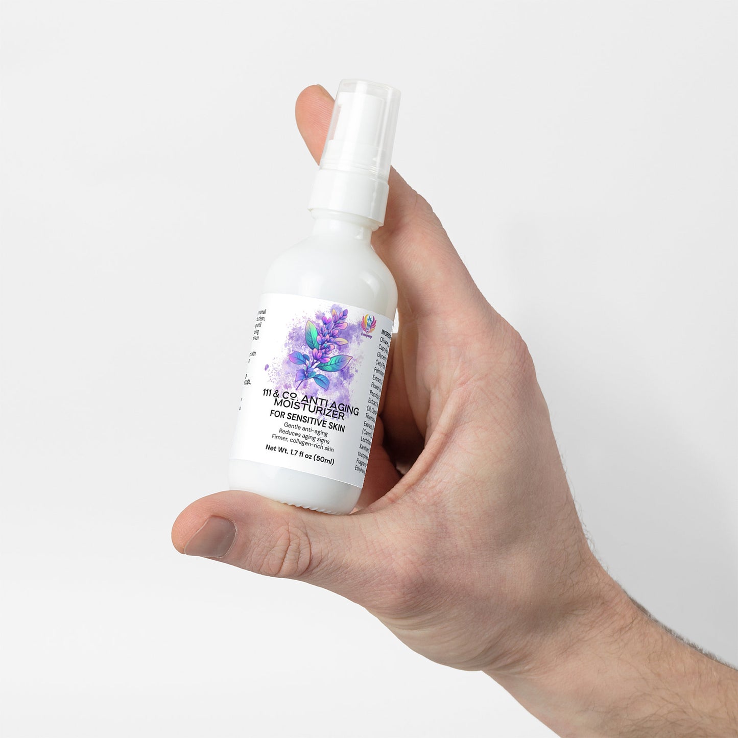 A hand holds a white spray bottle labeled 111 & Co. Anti Aging Moisturizer for Sensitive Skin. Adorned with purple flowers and black text, it promises enhanced skin elasticity. The 1.7 fl oz (50 ml) bottle, part of 111 & Company, features a spray nozzle against a plain backdrop.