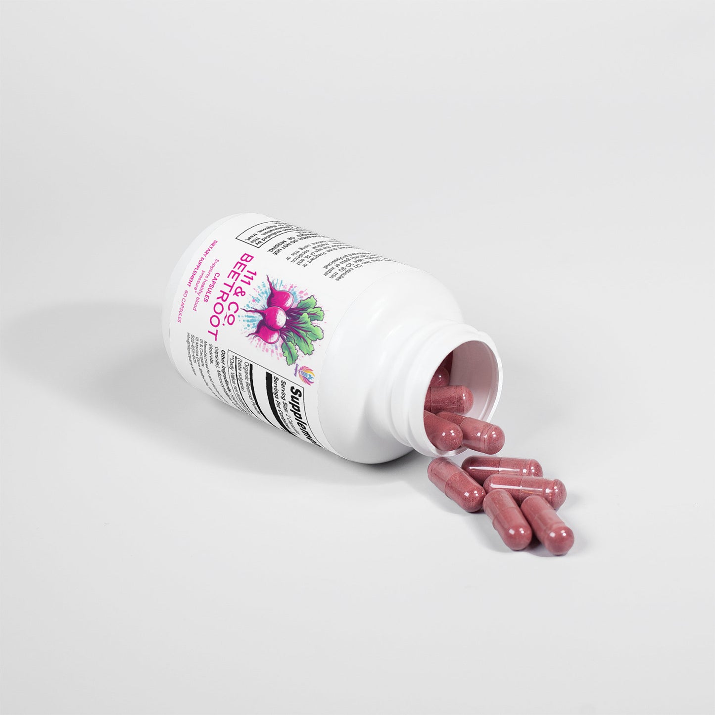 A white bottle of 111 & COMPANY BEETROOT CAPSULES by 111 & Company lies on its side against a plain white background, spilling pinkish-purple capsules known to boost nitric oxide for athletic performance. The label displays a beet image and text detailing benefits and contents.