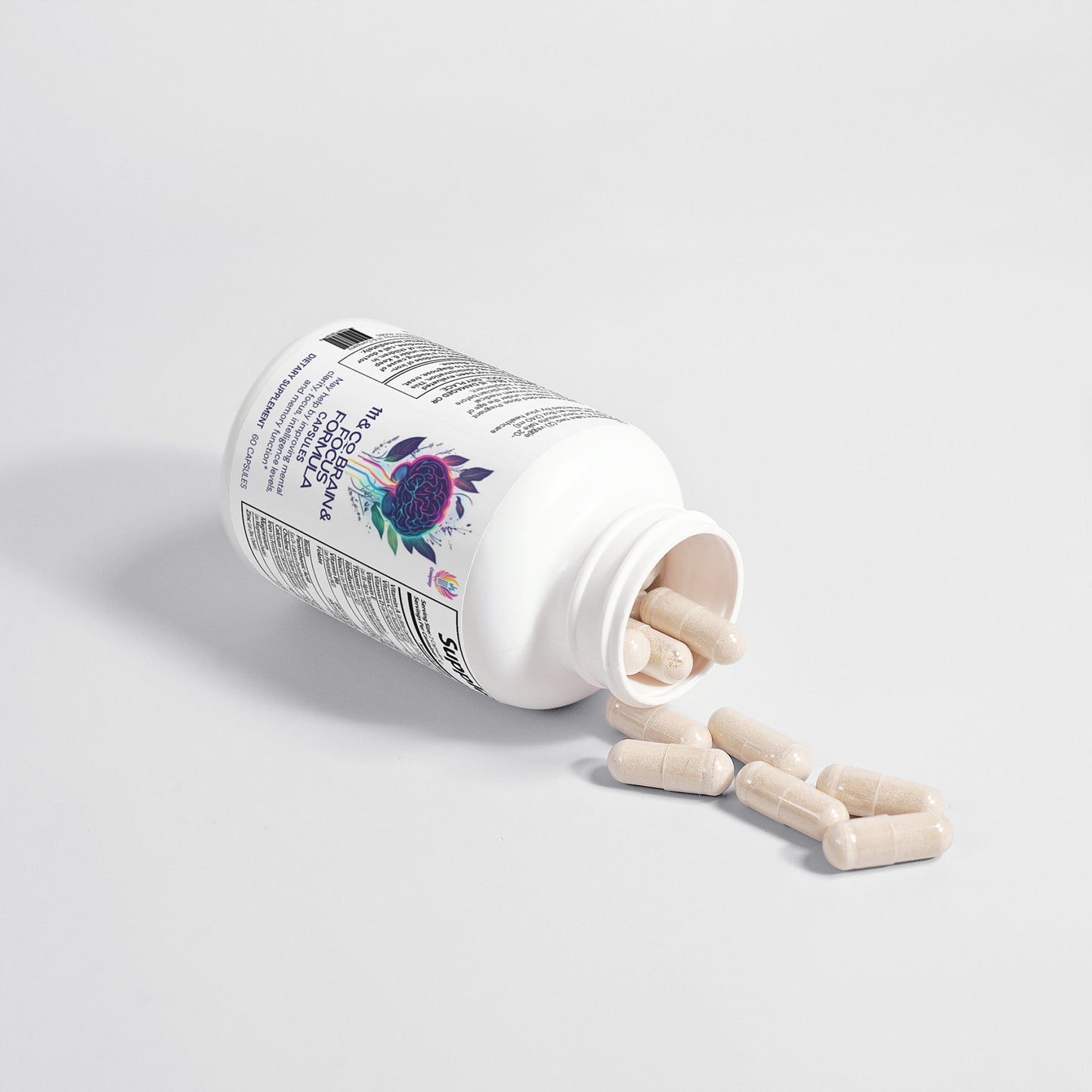 A white bottle of 111 & COMPANY BRAIN & FOCUS FORMULA by 111 & Company, featuring a colorful label with floral designs, lies on its side on a plain background. Beige capsules spill out, enhancing focus and hinting at boosted neuroactivity, though text details are unclear.