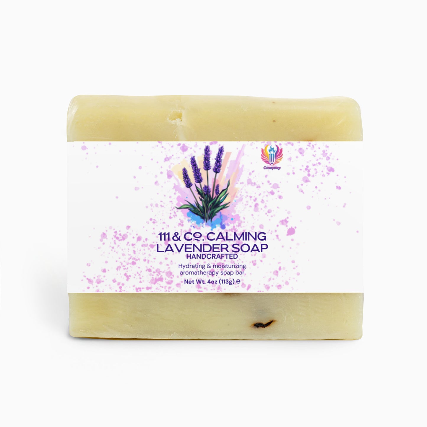 The 111 & Company Calming Lavender Soap is a handcrafted, off-white bar with a label reading 111 & Co. Calming Lavender Soap. Infused with lavender essential oil and featuring lavender sprigs and purple splashes, its ideal for sensitive skin, offering hydration and moisturizing benefits. Weighs 4 oz (113g).