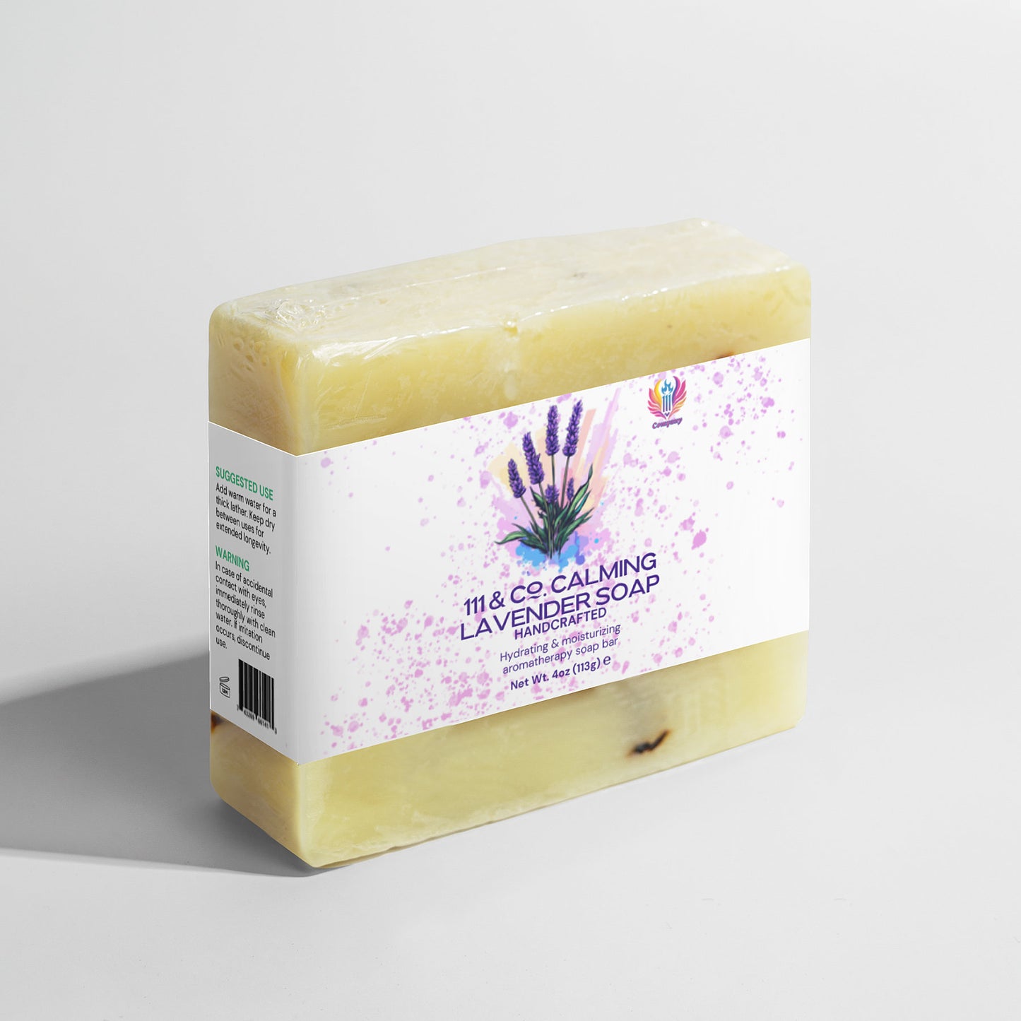 The 111 & Company Calming Lavender Soap features soothing lavender designs and ingredient details, enhanced with calming lavender essential oil. Ideal for sensitive skin, this beige 6 oz (170g) bar sits against a pristine white background.