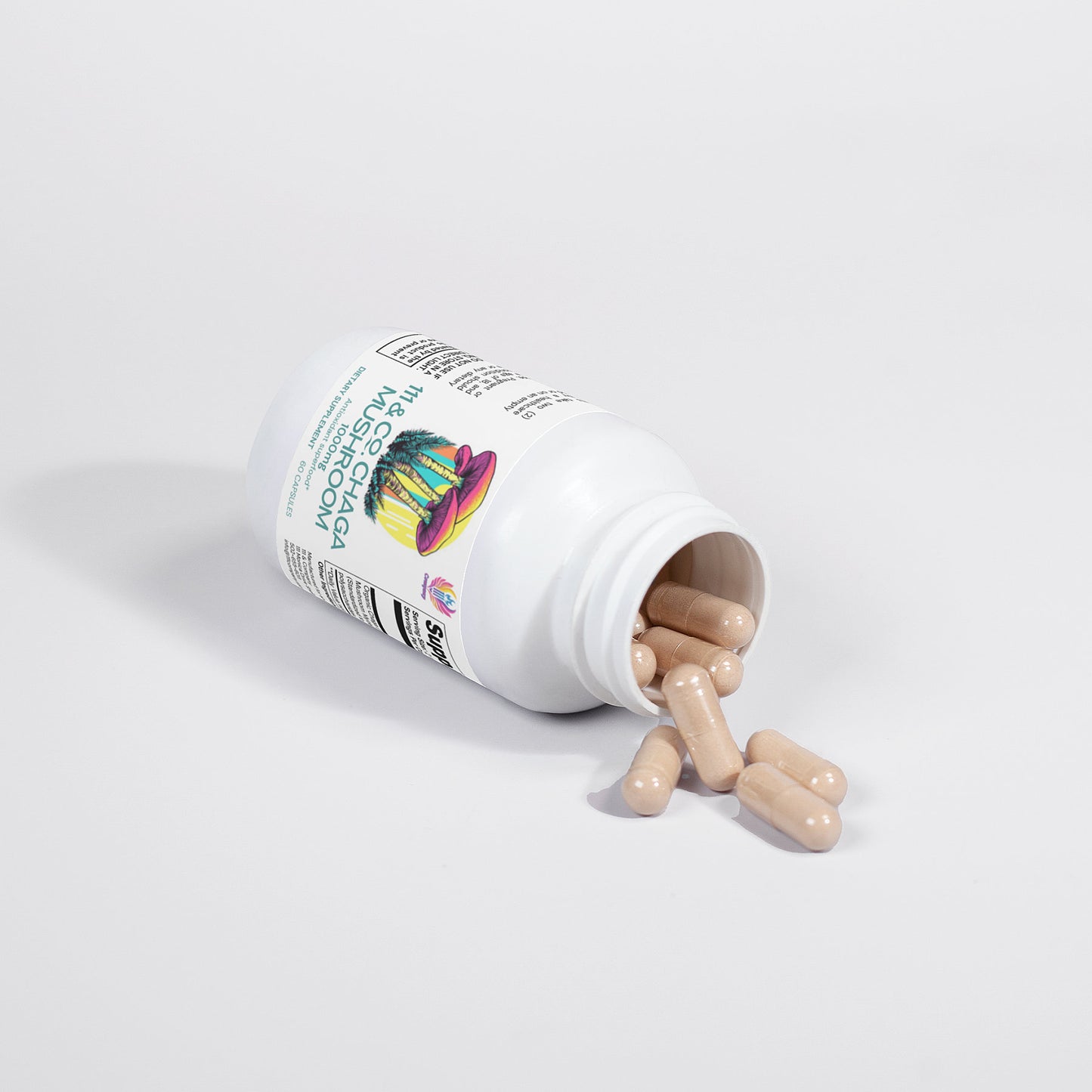 A tipped white bottle of 111 & Company Chaga Mushroom 1000 mg capsules spills beige capsules on a white surface. The label shows vibrant graphics with the words Mushroom and Lions Mane, partially visible, while a barcode completes the scene.