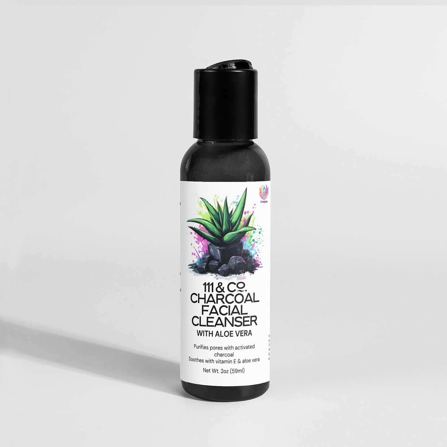 A 2oz bottle of 111 & Company Charcoal Facial Cleanser is set against a light gray backdrop. The label features an aloe plant with colorful accents, highlighting its paraben-free formula with activated charcoal, vitamin E, and aloe vera for daily pore cleaning.