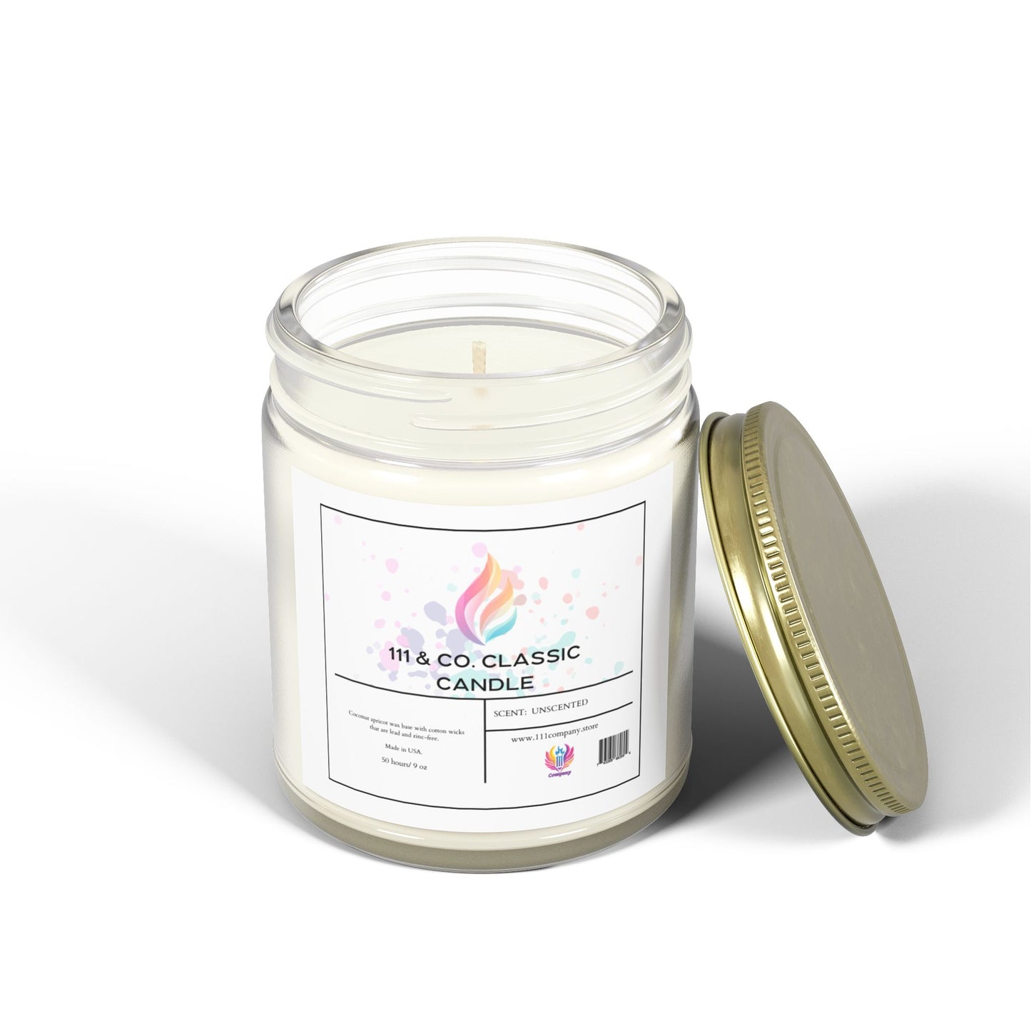 Clear glass jar candle with the gold lid beside it; label says 111 & Company Classic Unscented Candle with a colorful flame graphic. Made from coconut apricot wax by 111 & Company, the white wax emits a calming glow, and features decorative pastel dots on the label.