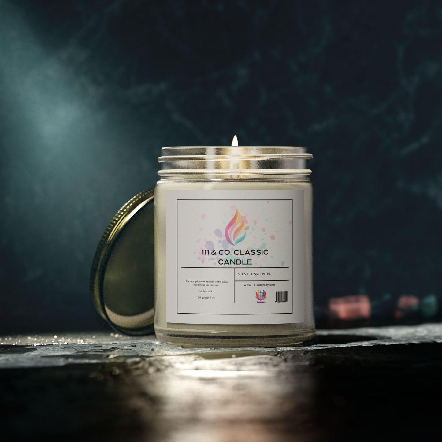 A lit, white coconut apricot wax candle from 111 & Company rests in a clear jar with a gold lid, emanating a calming glow on a reflective surface. Its label reads 111 & Company Classic Unscented Candle with a flame design, set elegantly against a dark background.