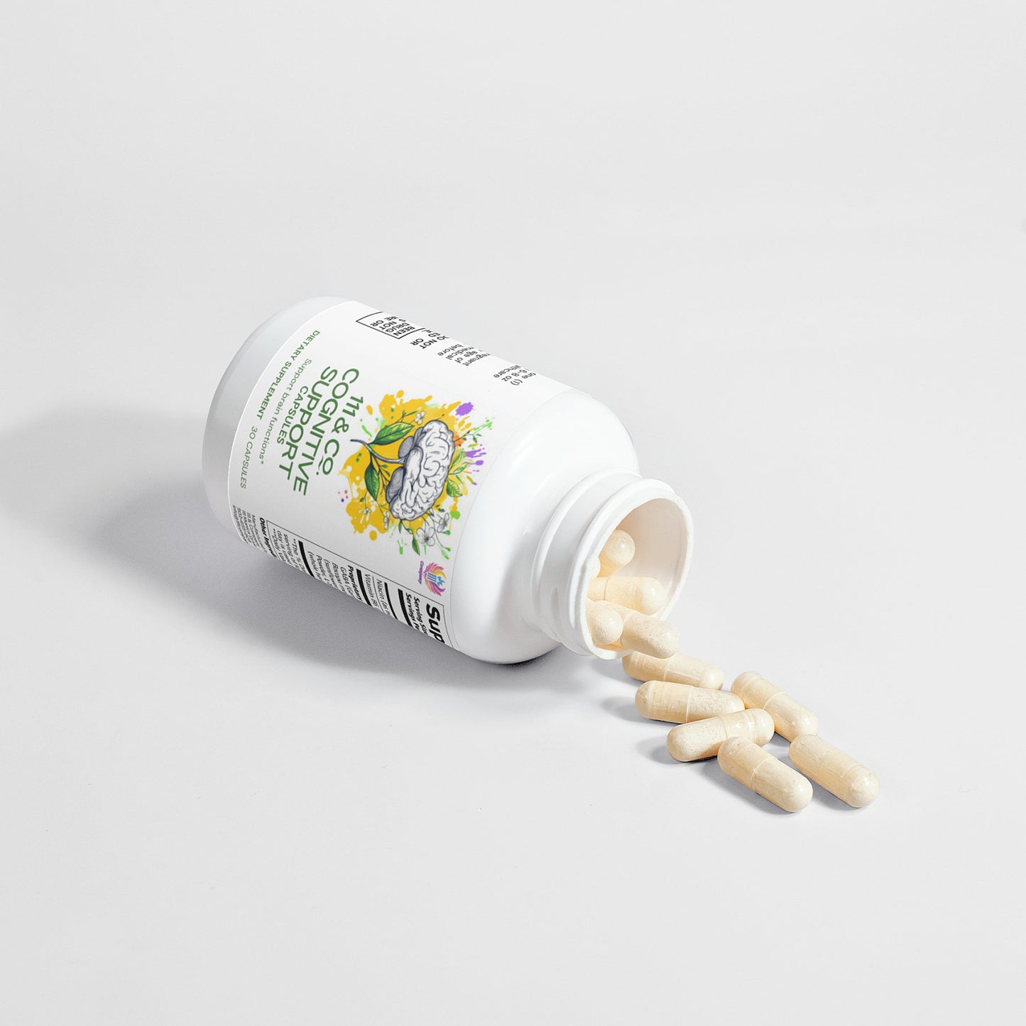 A white 111 & COMPANY COGNITIVE SUPPORT CAPSULES bottle by 111 & Company rests on its side against a white background, with beige capsules spilling out. The label features herb and lotus illustrations, emphasizing natural ingredients and supplement information.
