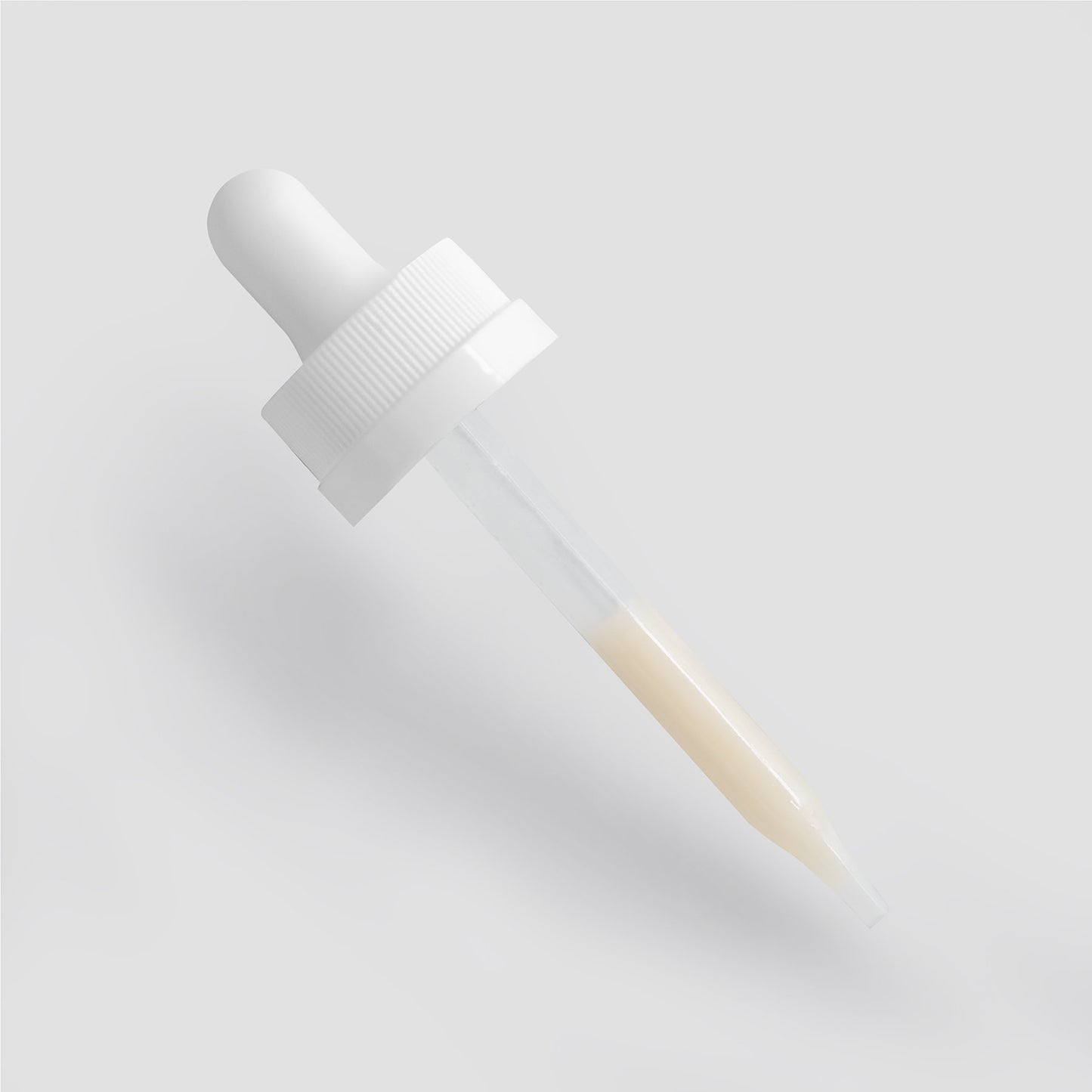 The 111 & Company Dark Spot Serum for Normal Skin features a white dropper with a ribbed grip cap and clear glass pipette, holding a light yellow serum. It is set diagonally on a light gray background, tip pointing downward, designed to reduce dark spots and promote an even skin tone.