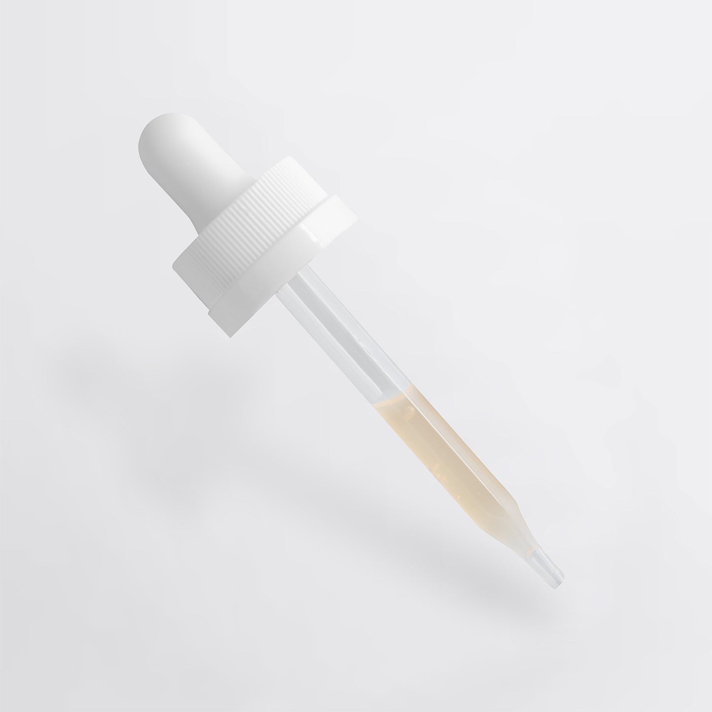 The 111 & COMPANY DARK SPOT SERUM, ideal for sensitive skin, features a clear glass dropper with white rubber bulb and cap, partially filled with light amber liquid. Elegantly angled against a white background, it highlights its natural ingredients.