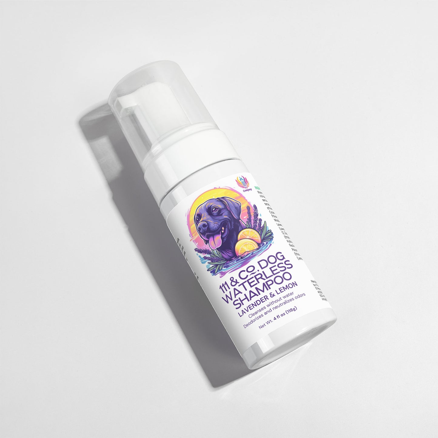 The 111 & Company Dog Waterless Shampoo, a deodorizing white 4-ounce bottle with a pump dispenser, features a label illustration of a black dog among lavender flowers and lemon slices. Its scented Lavender & Lemon.