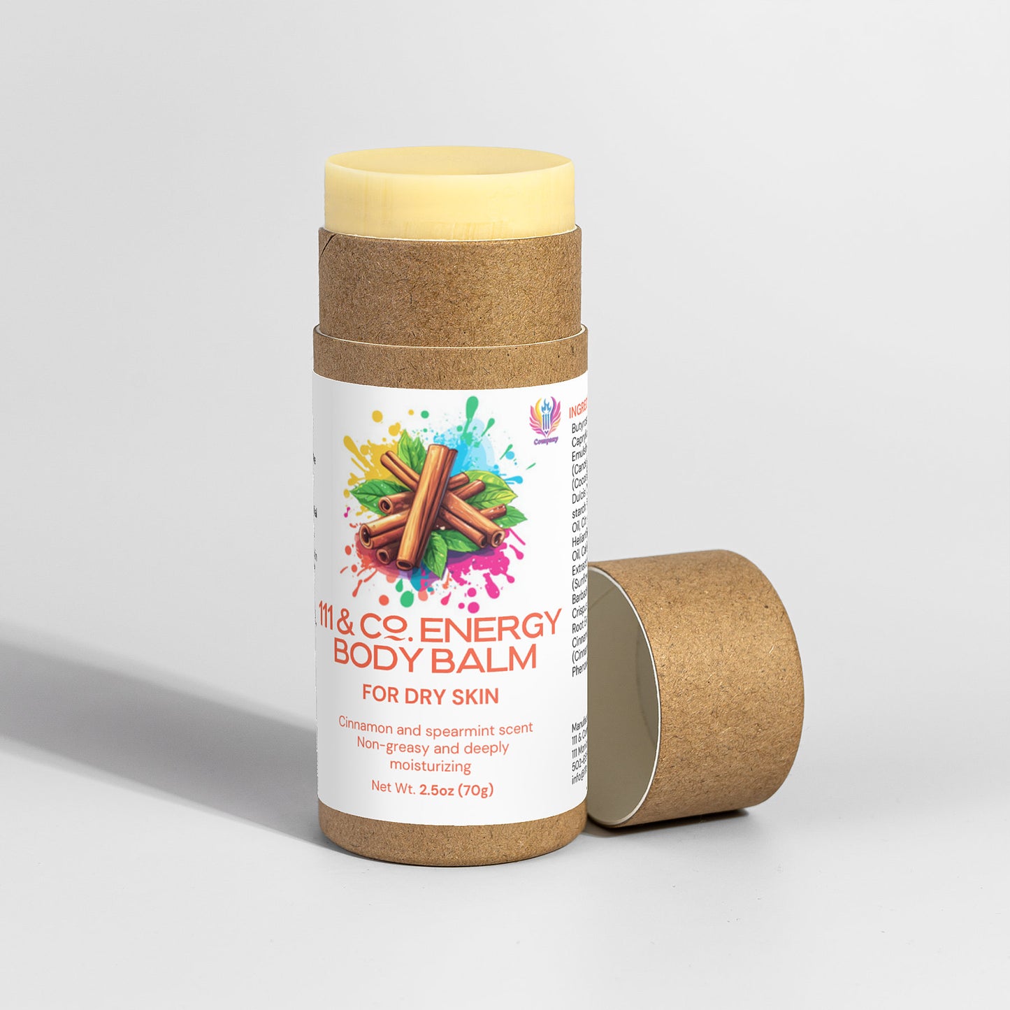 A cylindrical 111 & Company Energy Body Balm container is displayed with its lid off. The label shows cinnamon sticks, colorful splashes, and notes a moisturizing treatment for dry skin with a cinnamon and spearmint scent, offering aromatherapy benefits. It weighs 2.5 oz.