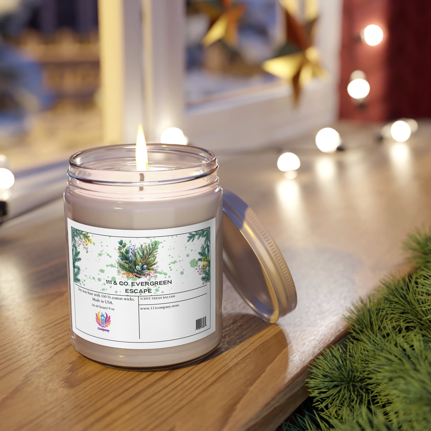 The 111 & COMPANY Evergreen Escape Fresh Balsam scented candle by 111 & Company, housed in a glass jar featuring evergreen and pine cone illustrations, emits a soothing eucalyptus fragrance on a wooden surface. Nearby, festive decor and pine branches add to the ambiance.