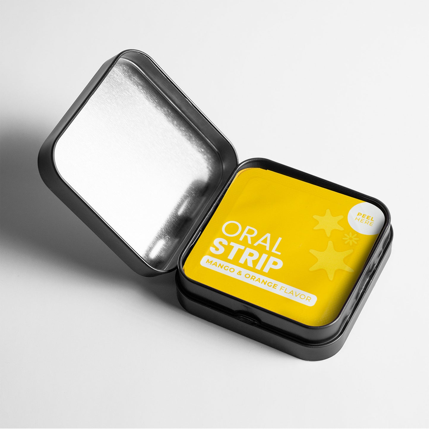 Unveil a sleek black tin box with a yellow packet of 111 & COMPANY HANGOVER STRIPS (MANGO & ORANGE) by 111 & Company. The stylish square packet features rounded edges, a peel tab, and fruity icons. A silver interior lid boosts the wellness offerings appeal.