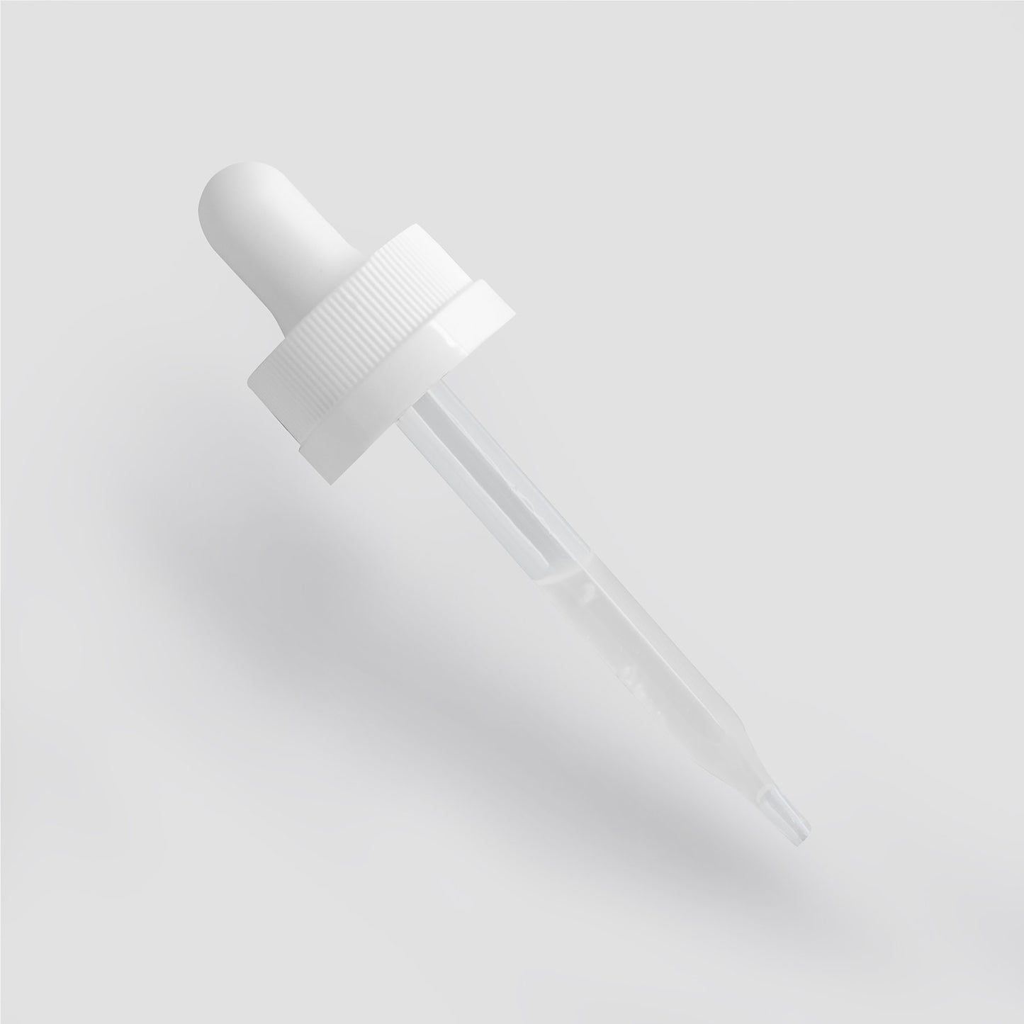 A white dropper with a ribbed cap and transparent glass tube rests on a light gray background, ideal for dispensing 111 & Companys Hyaluronic Acid Serum. Its rounded rubber top and tapering glass tip enhance its hydrating and skin-rejuvenating function.
