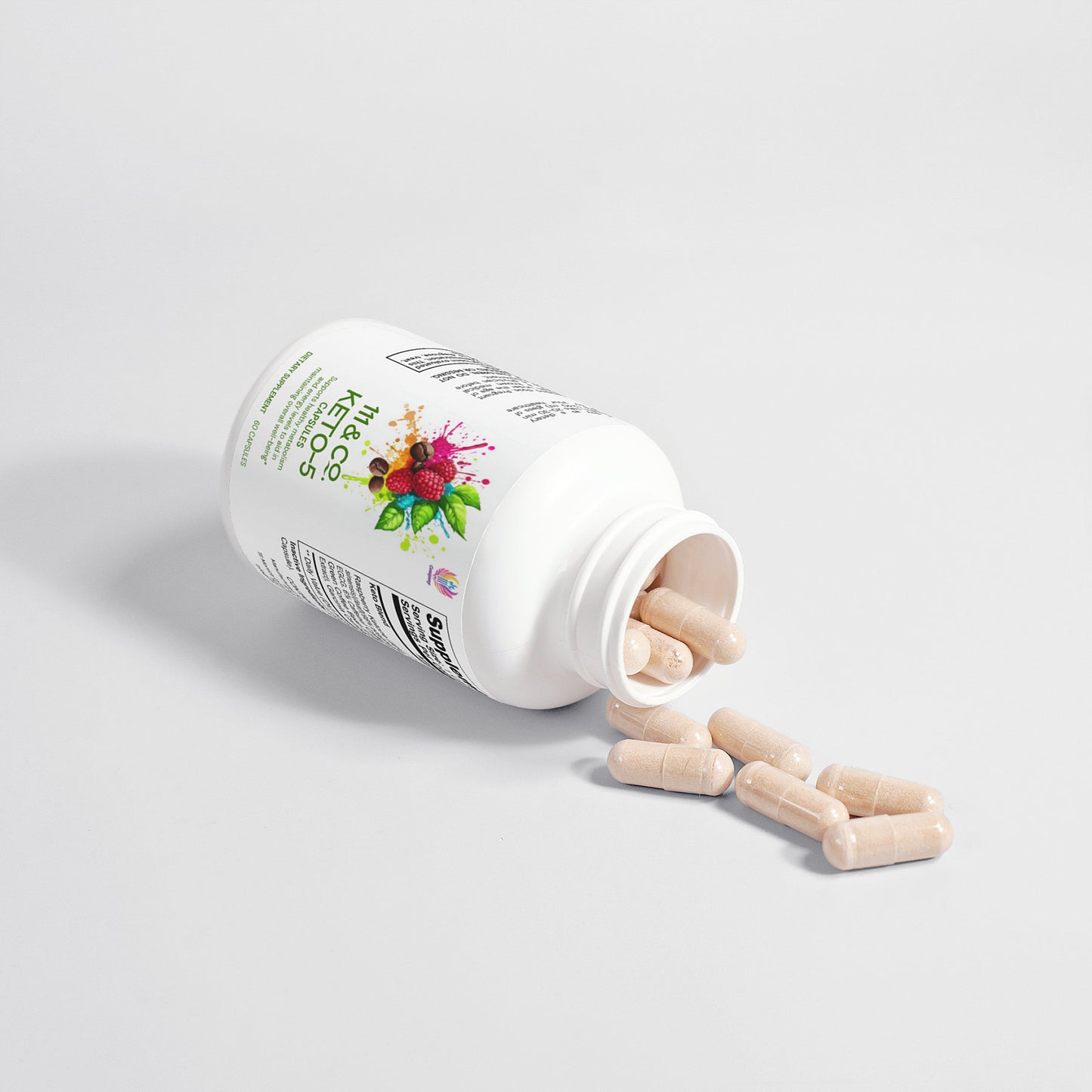 A white plastic bottle labeled 111 & COMPANY KETO-5 by 111 & Company is tipped over, spilling beige capsules onto a white surface. The vibrant abstract shapes and text on the label hint at its keto supplement benefits, while the cap casts a shadow on the pristine surface.