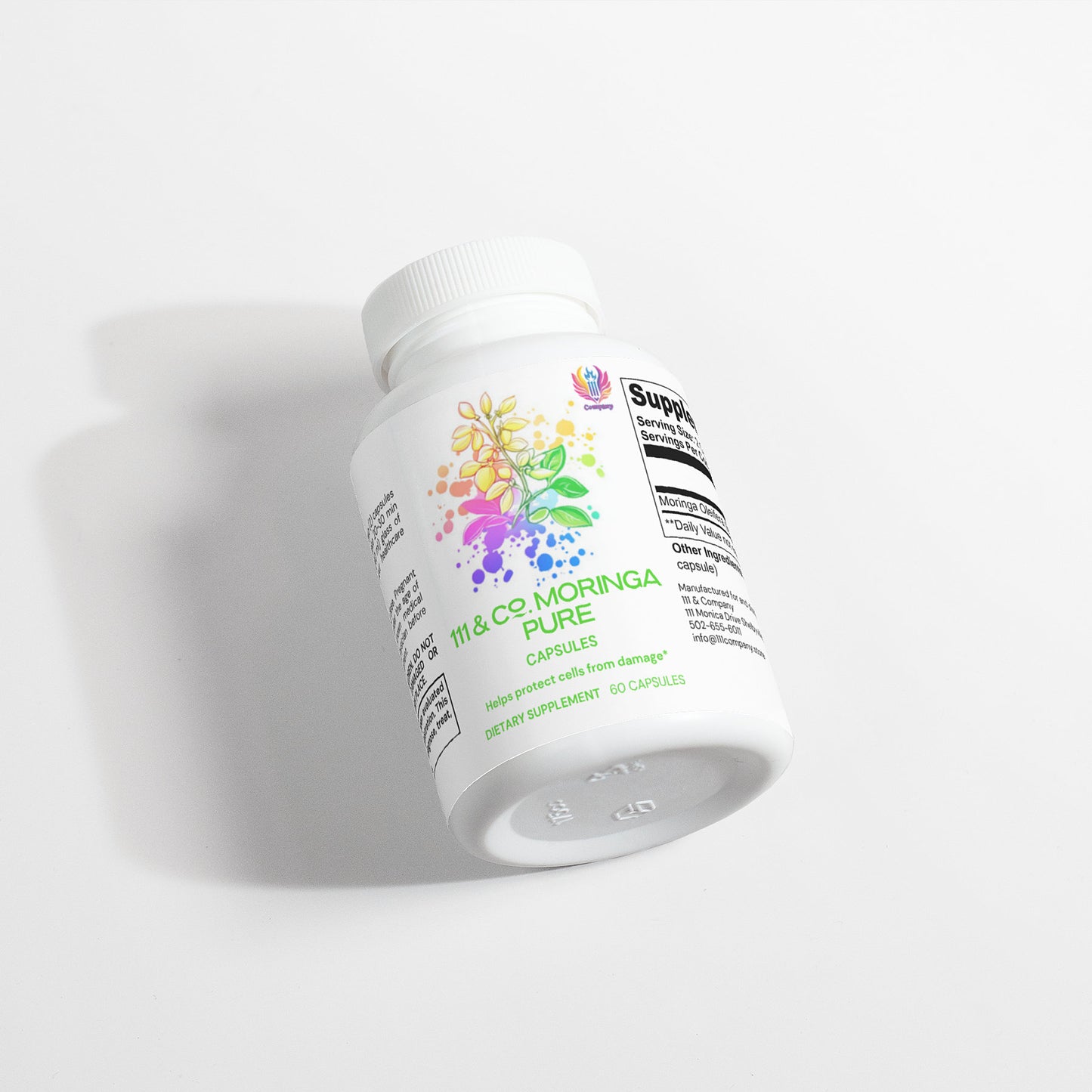 A white bottle of 111 & COMPANY MORINGA PURE CAPSULES rests on its side against a white background. The label, featuring vibrant botanical illustrations, is partially readable as shadows extend gracefully to the left.