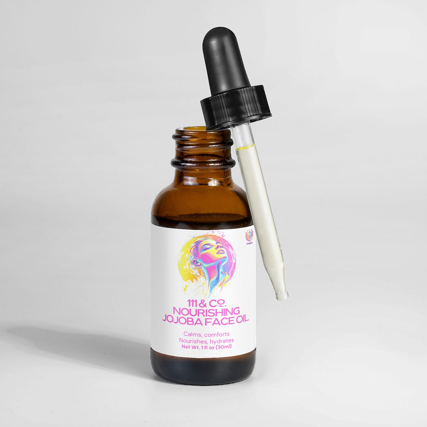 The 111 & COMPANY NOURISHING JOJOBA FACE OIL by 111 & Company stands upright, featuring an illustrated face on the label. The dropper cap rests against the glass bottle filled with luxurious jojoba seed oil, presented elegantly against a plain white background.