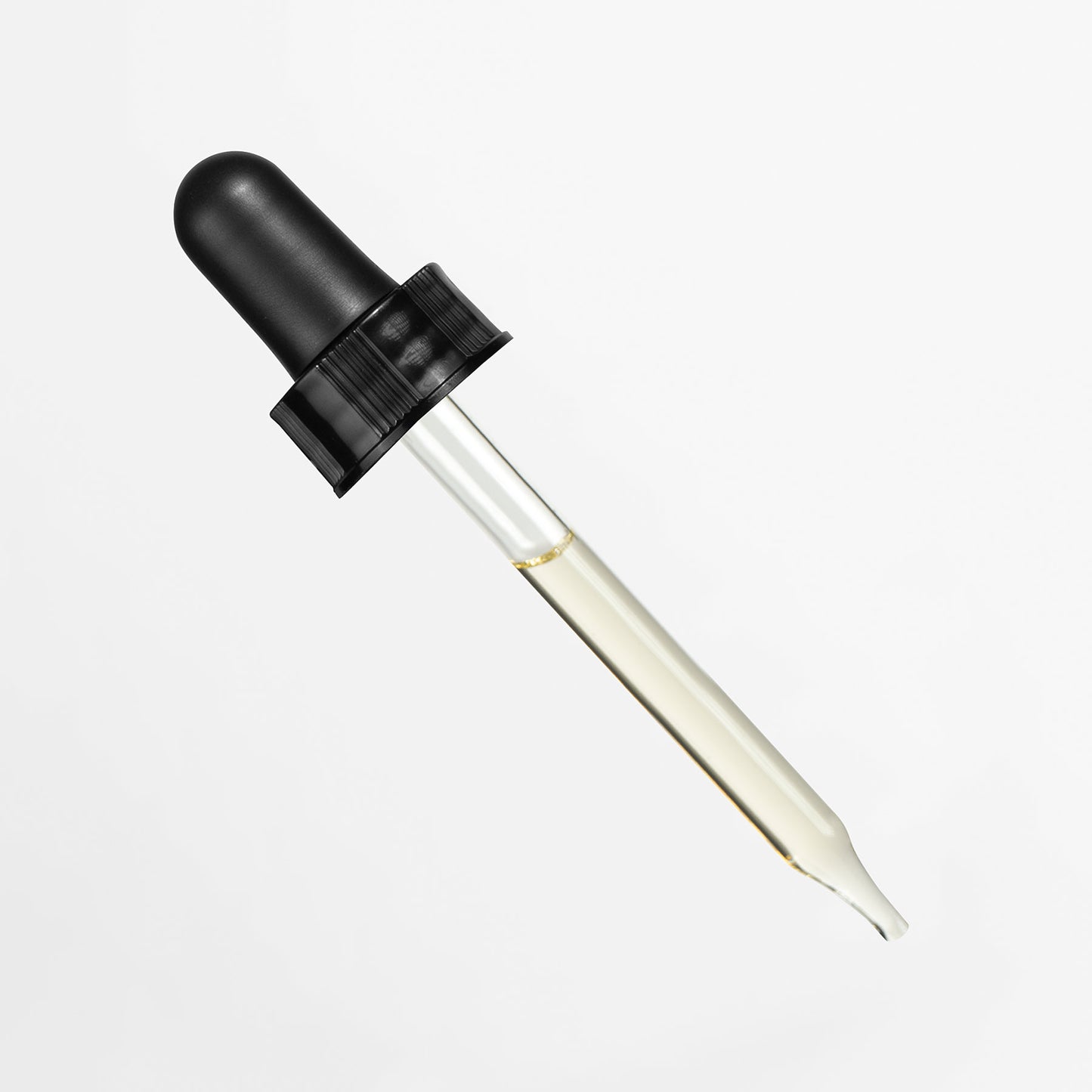 The 111 & COMPANY NOURISHING JOJOBA FACE OIL comes with a glass dropper at a diagonal angle against a white background. It features a black rubber top with grooved grips for easy use, and its narrow tip ensures precise dispensing of the transparent face oil inside.
