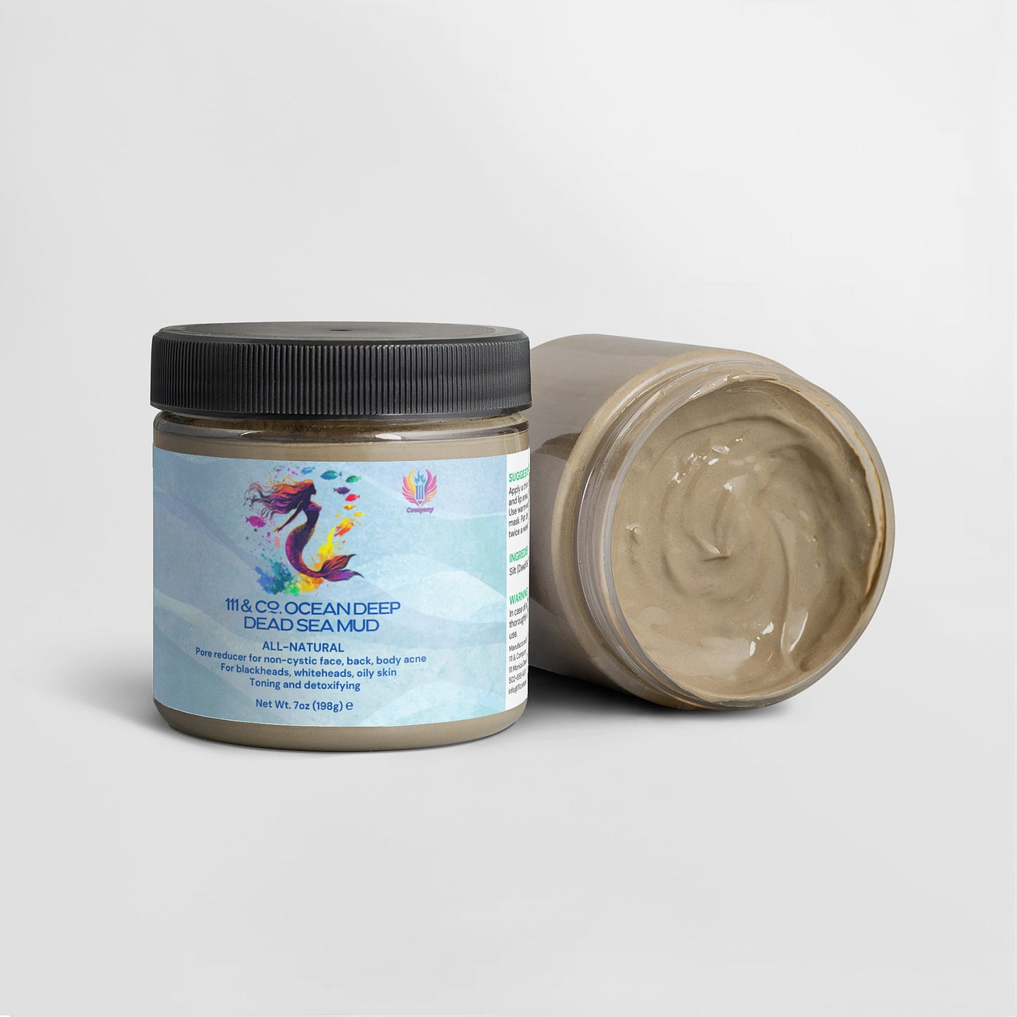 Two containers of 111 & Company Ocean Deep Dead Sea Mud are displayed. One jar stands upright with a blue label featuring a colorful mermaid and text. The other jar is open, revealing thick grayish mud. The label highlights its all-natural ingredients for hair and body care.