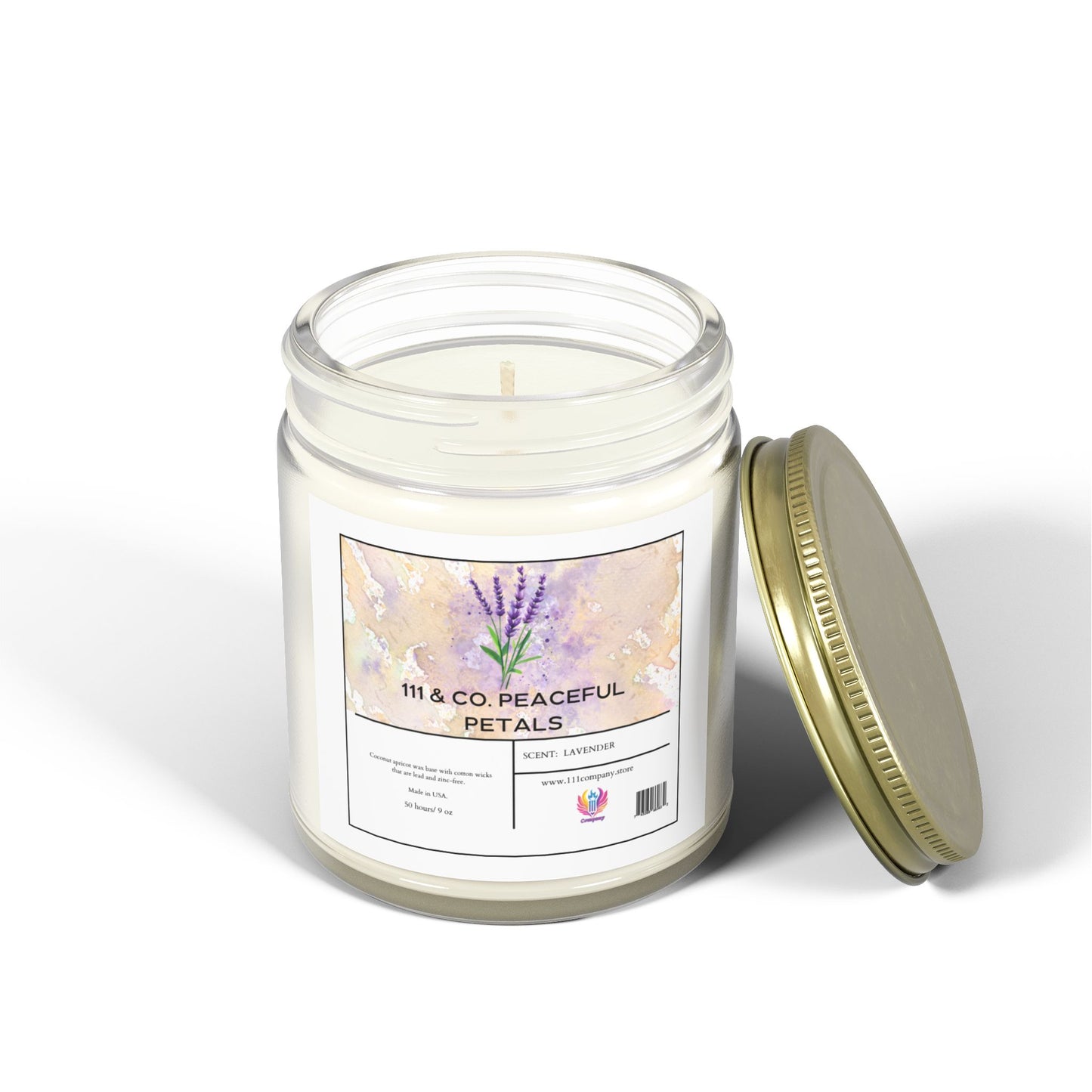 A white candle in a clear glass jar with a gold lid lies beside it, labeled 111 & Company Peaceful Petals with lavender illustrations, made from eco-friendly coconut apricot wax. This 9oz candle by 111 & Company is on a white surface, casting a soft shadow and inviting relaxation.