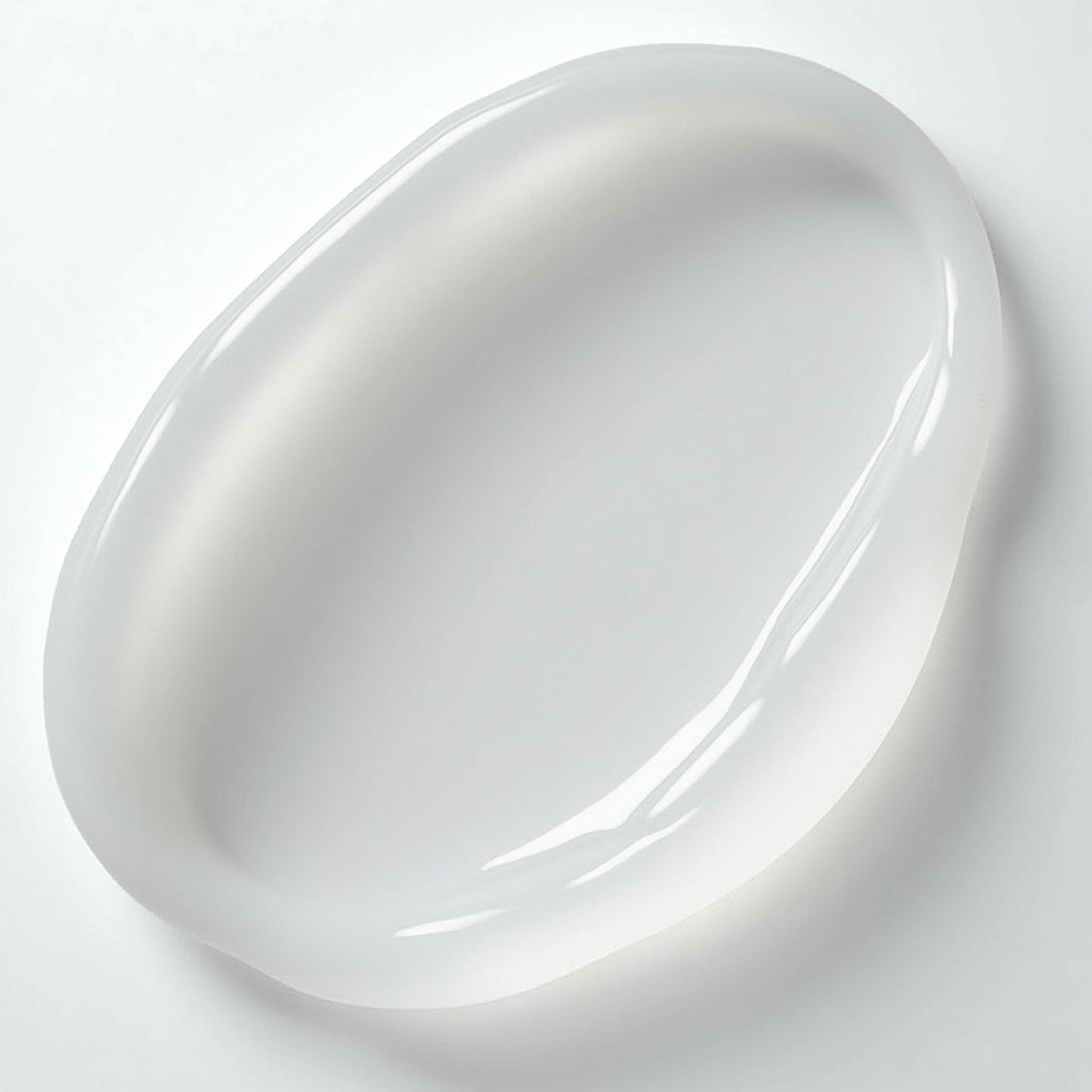 A glossy, transparent gel blob on a light gray surface, oval and smooth with sodium hyaluronate, reflects light beautifully. Its appearance suggests a skincare product like 111 & COMPANY PEPTIDE EYE CREAM from 111 & Company, conveying hydration and smoothness.