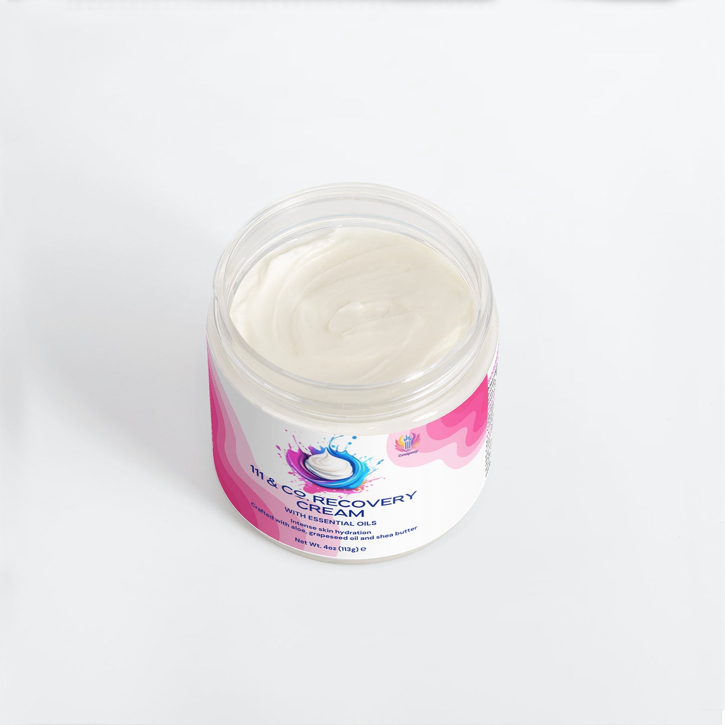 An open jar of 111 & COMPANY RECOVERY CREAM from 111 & Company sits on a white surface, offering optimal skin hydration. The label features pink and purple swirls with an abstract water splash design.