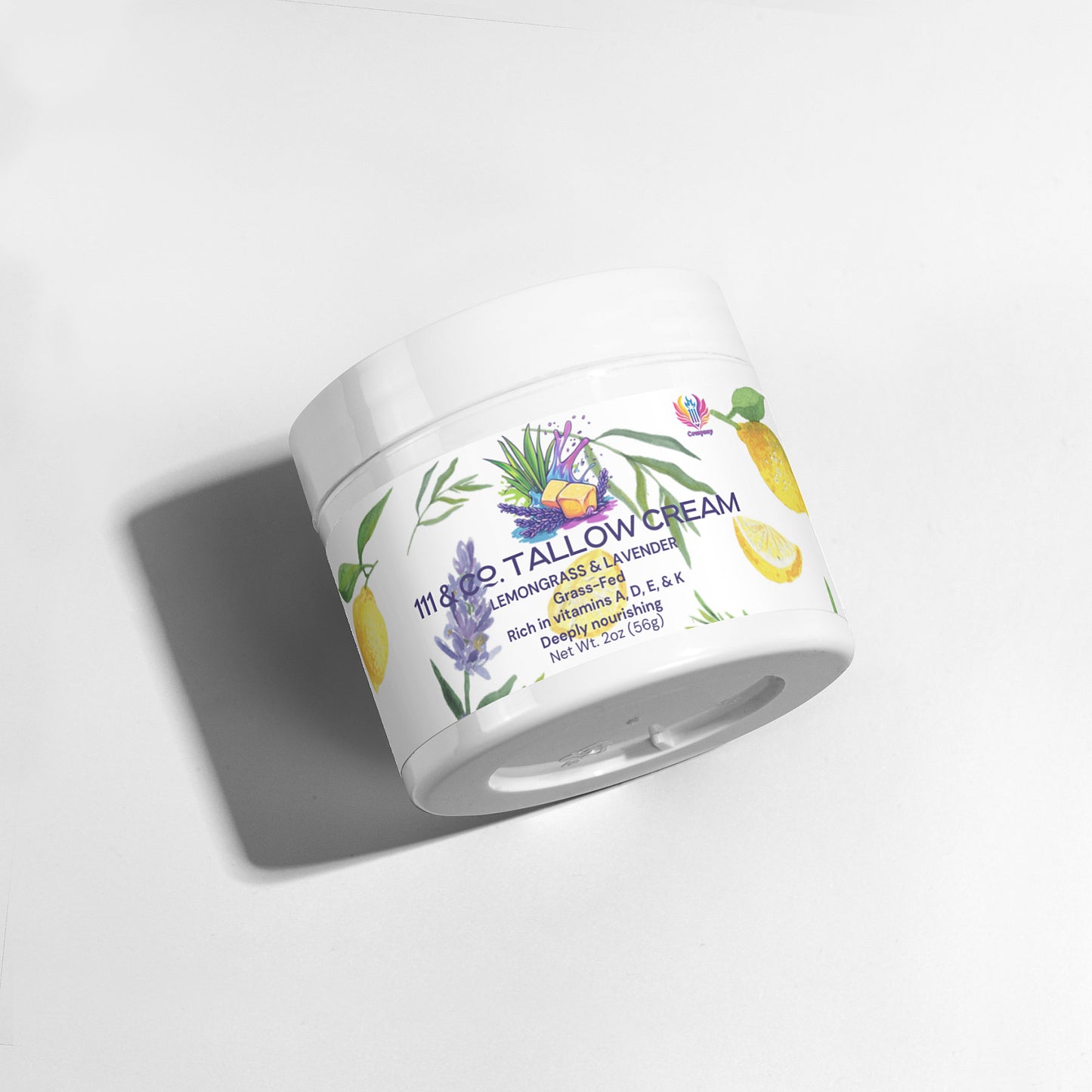 A white jar of 111 & COMPANY TALLOW CREAM LEMONGRASS & LAVENDER by 111 & Company rests at an angle on a white surface. The label features botanicals and highlights vitamins A, D, E, & K for luxurious hydration for sensitive skin.