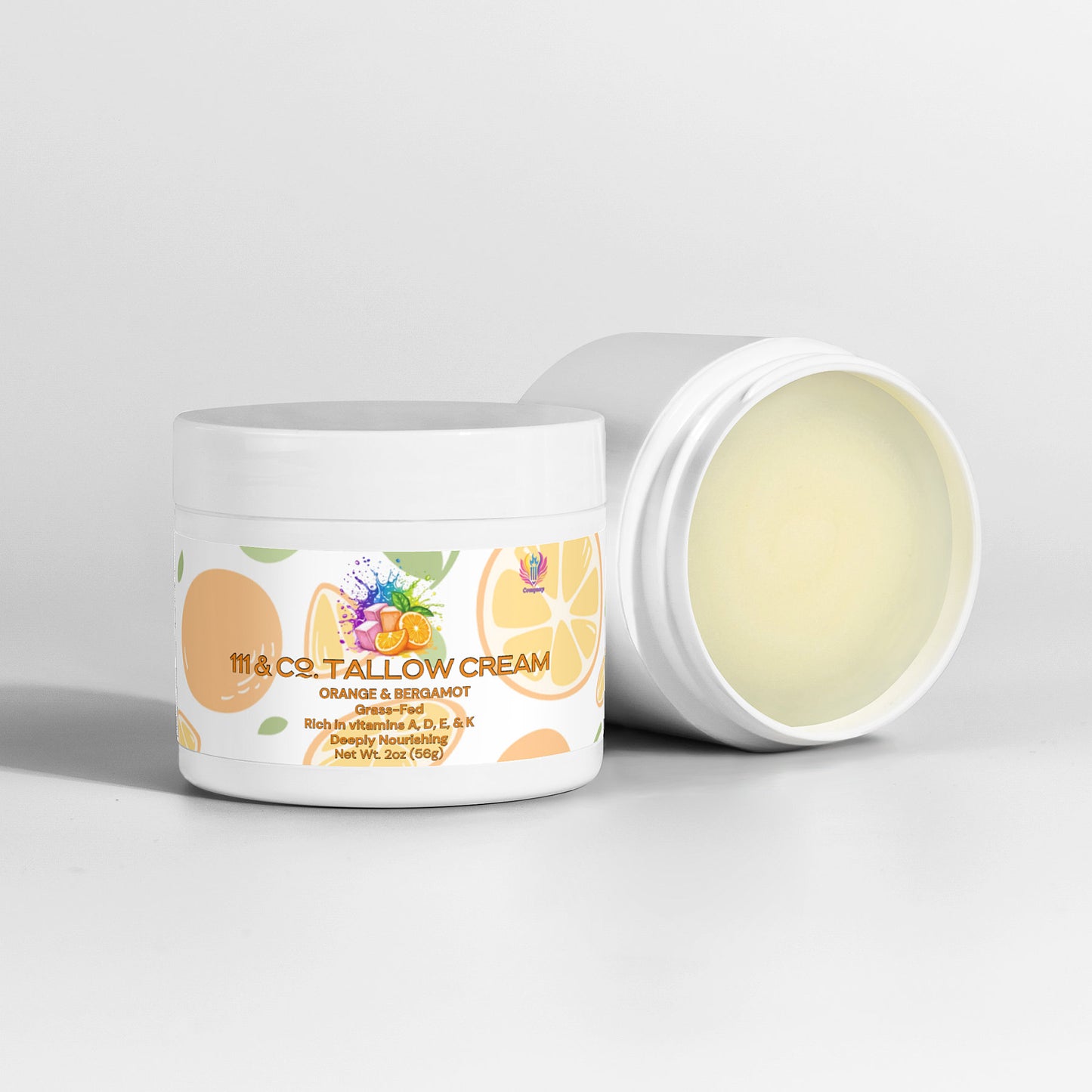 Two white jars of cream are showcased against a plain backdrop. The front jar, open to reveal a pale yellow blend enriched with grass-fed beef tallow, displays the label 111 & COMPANY Tallow Cream Orange & Bergamot from 111 & Company, adorned with citrus and leaf illustrations. A closed jar sits behind.