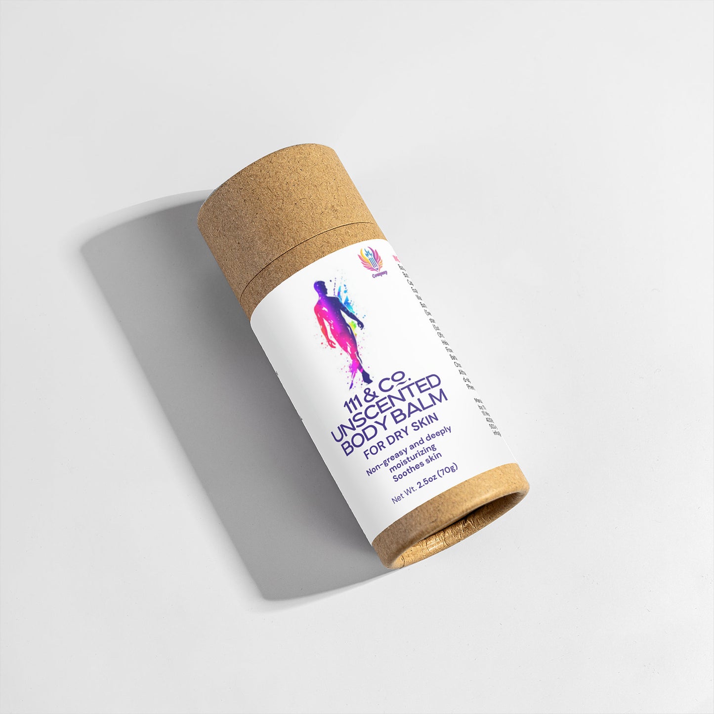A cylindrical, eco-friendly cardboard tube lies on a light surface, casting a soft shadow. It bears the label 111 & COMPANY UNSCENTED BODY BALM from 111 & Company. The packaging features colorful abstract artwork, stating the net weight as 3.5 oz (100g).