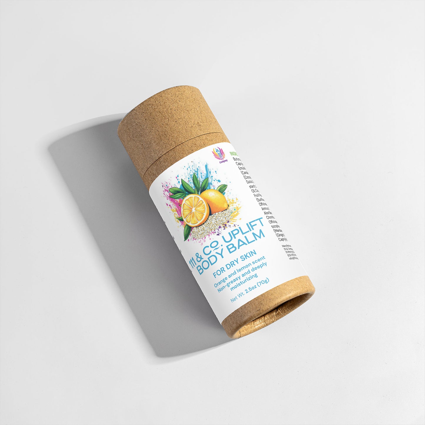 A cylindrical cardboard container of 111 & Company Uplift Body Balm by 111 & Company rests on a light surface, highlighting its eco-friendly design. The label displays lemons, blueberries, and mint leaves. The moisturizing balm weighs 3 ounces (70g) with a matching open lid.