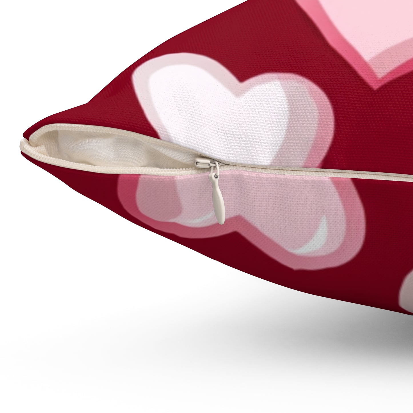 The 111 & Company Valentines Heart Pattern Pillow showcases a close-up of overlapping red, white, and pink hearts. It has a white zipper, revealing the inner material, with a textured fabric, making it an ideal Valentines Day gift.