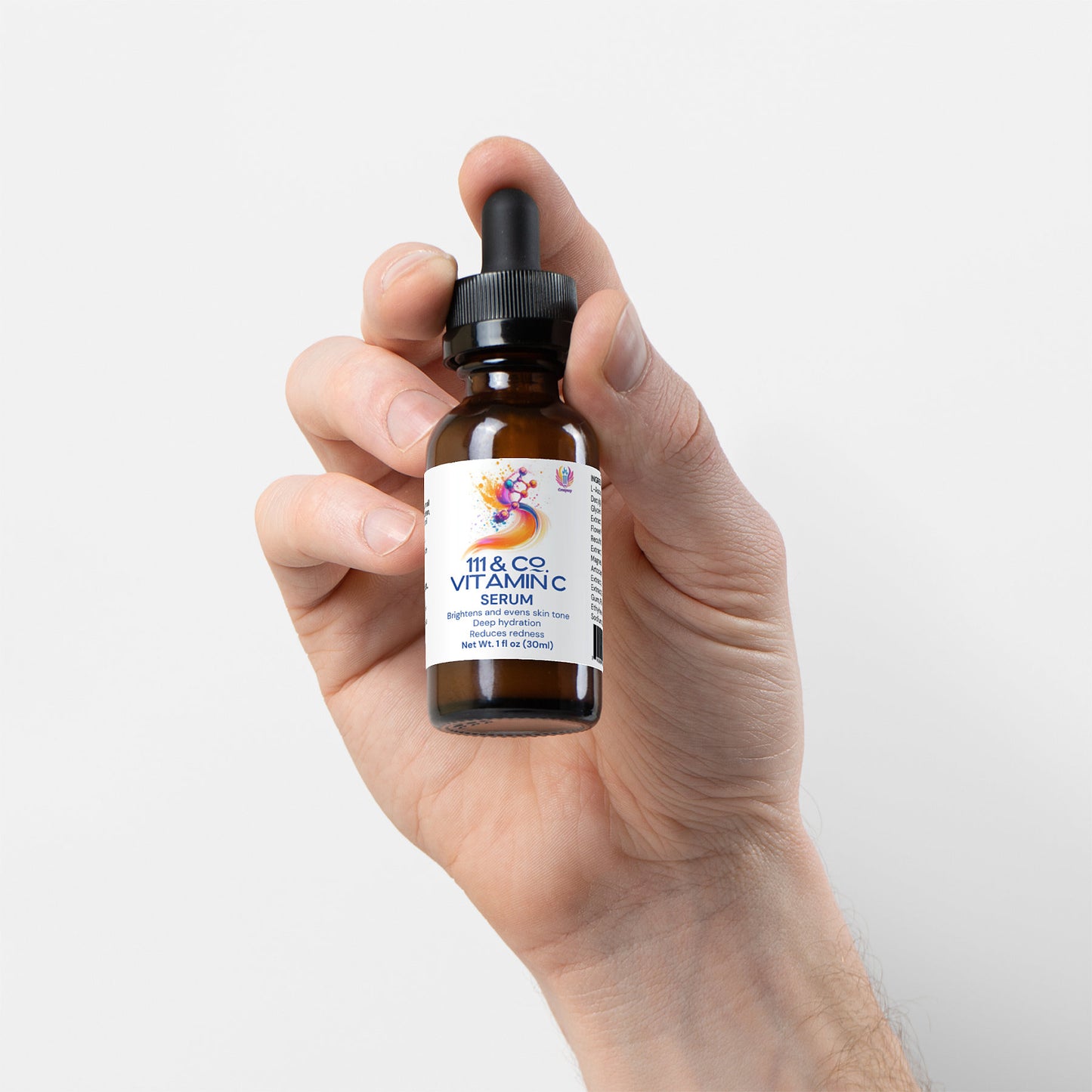 A hand holds a dark amber dropper bottle of 111 & COMPANY VITAMIN C SERUM by 111 & Company, featuring a colorful abstract label that reads Supercharged Antioxidant Formula and 1 fl oz (30 ml), showcasing its collagen-boosting properties against a plain white backdrop.