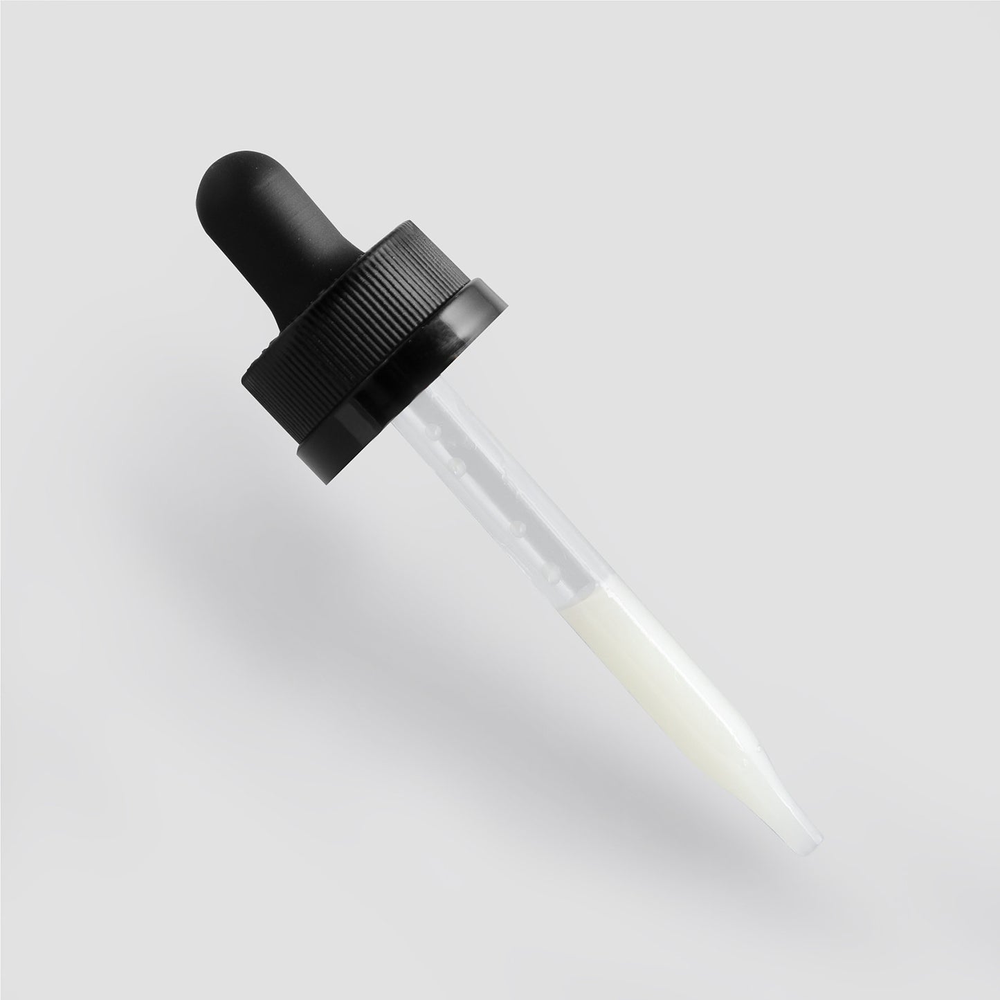 The 111 & COMPANY VITAMIN C SERUM from 111 & Company is shown with a glass dropper and black rubber bulb, partially filled with a translucent liquid known for its collagen-boosting properties. The cap features a textured grip for easy handling against a light gray background.