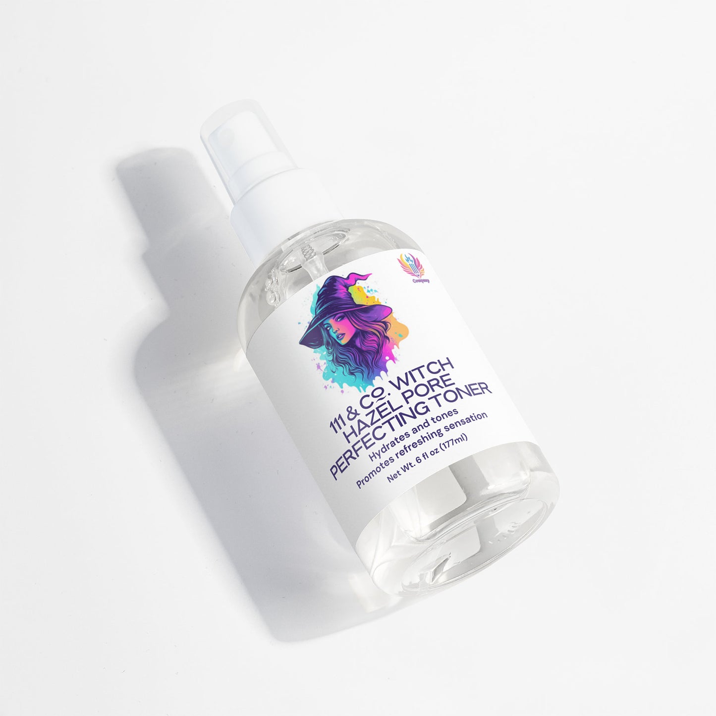 The 4 fl oz (118 ml) clear spray bottle of 111 & COMPANY WITCH HAZEL PORE PERFECTING TONER features a white label with colorful witch artwork. It contains Sodium Hyaluronate, doubles as a primer and setting spray, and casts a soft shadow on the white background.