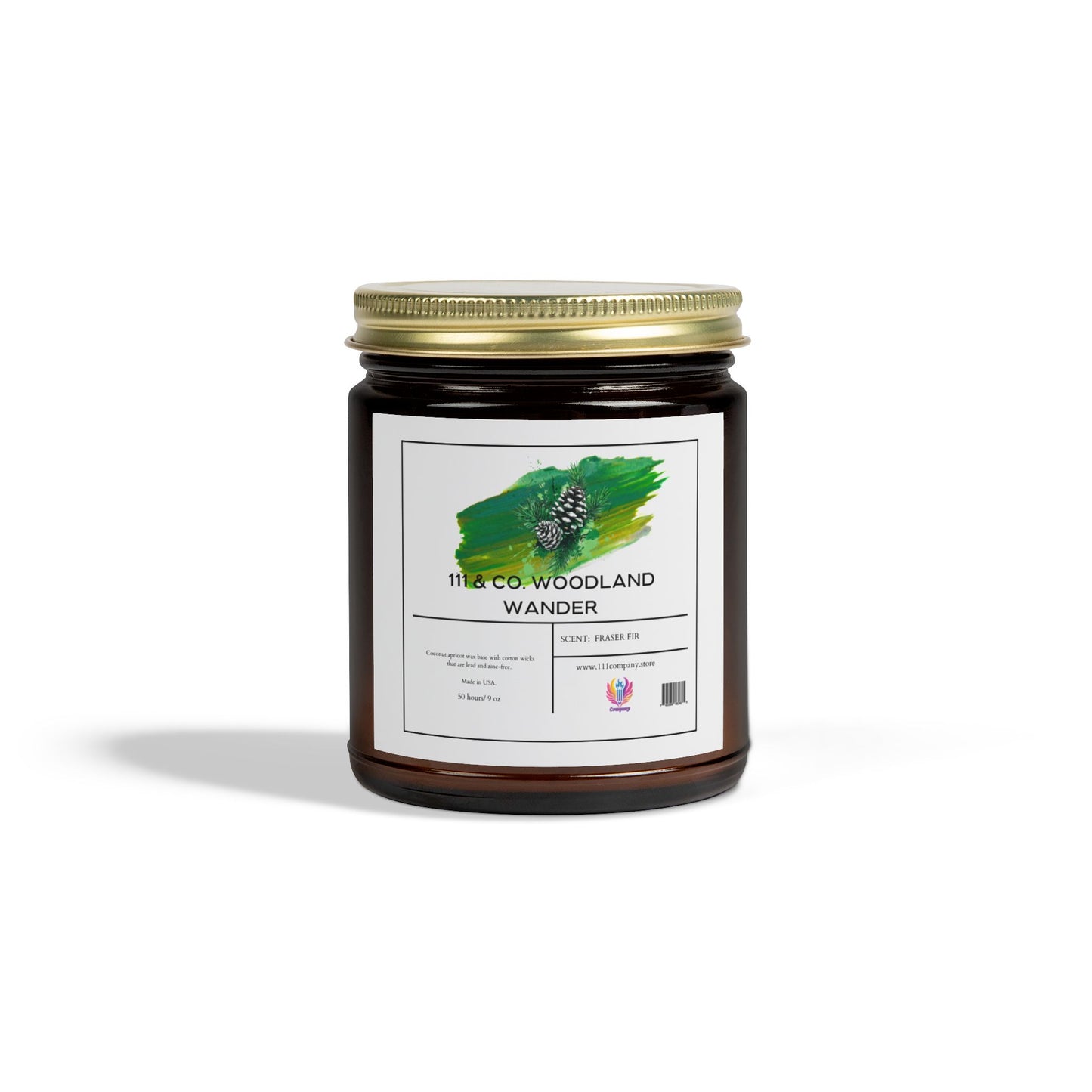 Against a white backdrop, an amber jar with a gold lid labeled 111 & Companys Woodland Wander features a pinecone on green, hinting at the Fraser Fir candle inside. Crafted by 111 & Company from natural Coconut Apricot Wax, it promises an exceptionally long burn time.