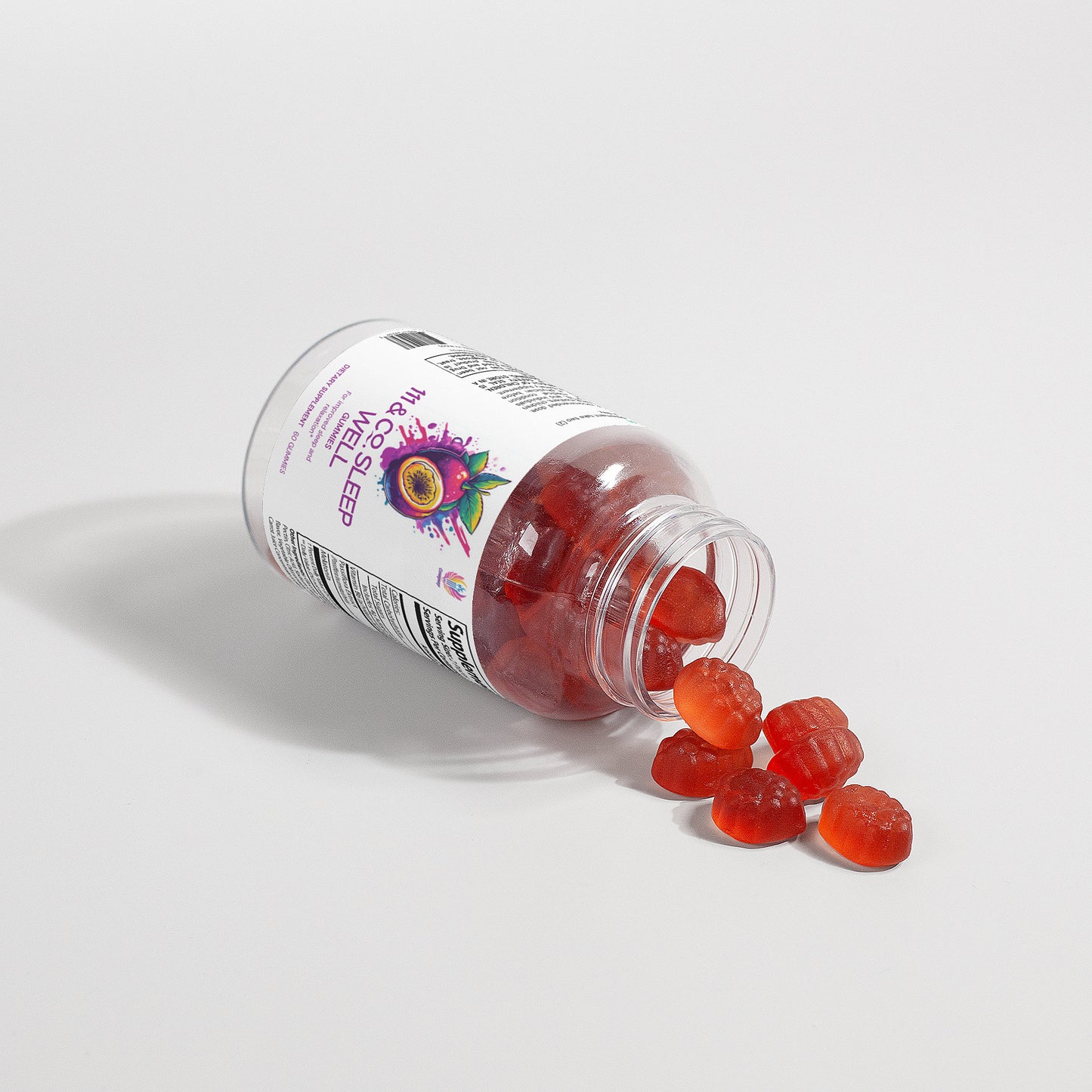 A clear plastic bottle labeled 111 & Company SLEEP WELL GUMMIES (ADULT) lies on its side on a white surface, spilling red, berry-shaped melatonin gummies. The label has a colorful fruit graphic and visible nutrition information.