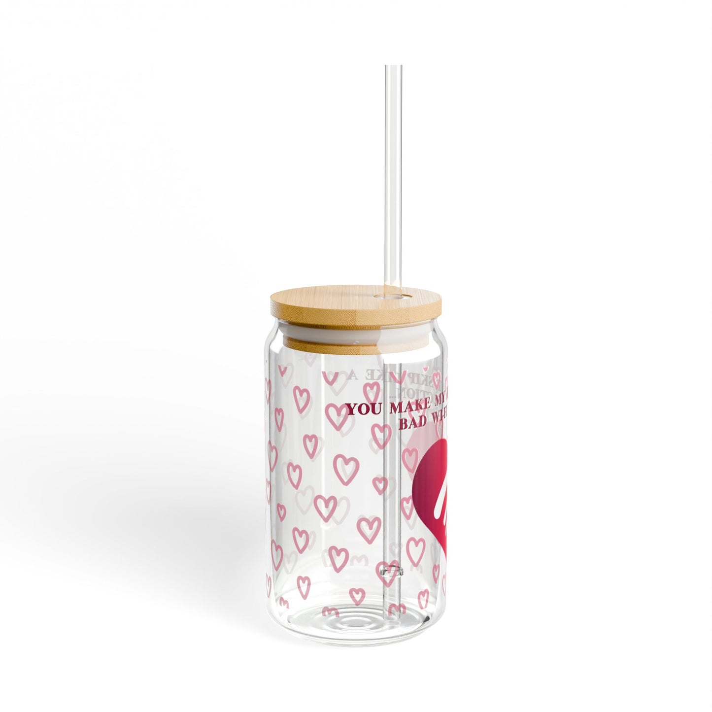 The Valentines WiFi Sipper Glass (16 oz) is a charming piece featuring pink heart patterns, a bamboo lid, and a transparent straw. You make my is inscribed between hearts, making it a whimsical addition to any barware collection.