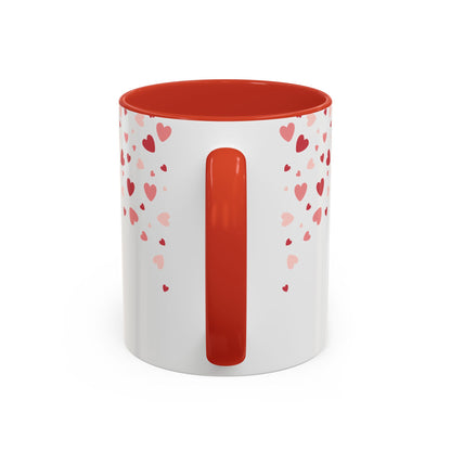 The Printify 111 & COMPANY Valentines Eiffel Tower Coffee Mug, with a white exterior, red interior and handle, features scattered red and pink hearts in varying sizes. This charming 11 oz mug adds a romantic touch to your morning routine.