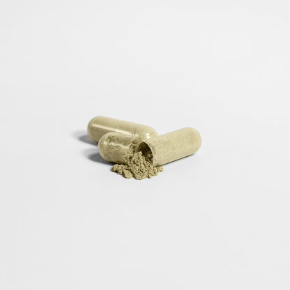 Two translucent 111 & COMPANY NOURISH HAIR, SKIN & NAILS CAPSULES from 111 & COMPANY, on a white background; one partially open, spilling beige powder infused with biotin for healthy skin and hair.