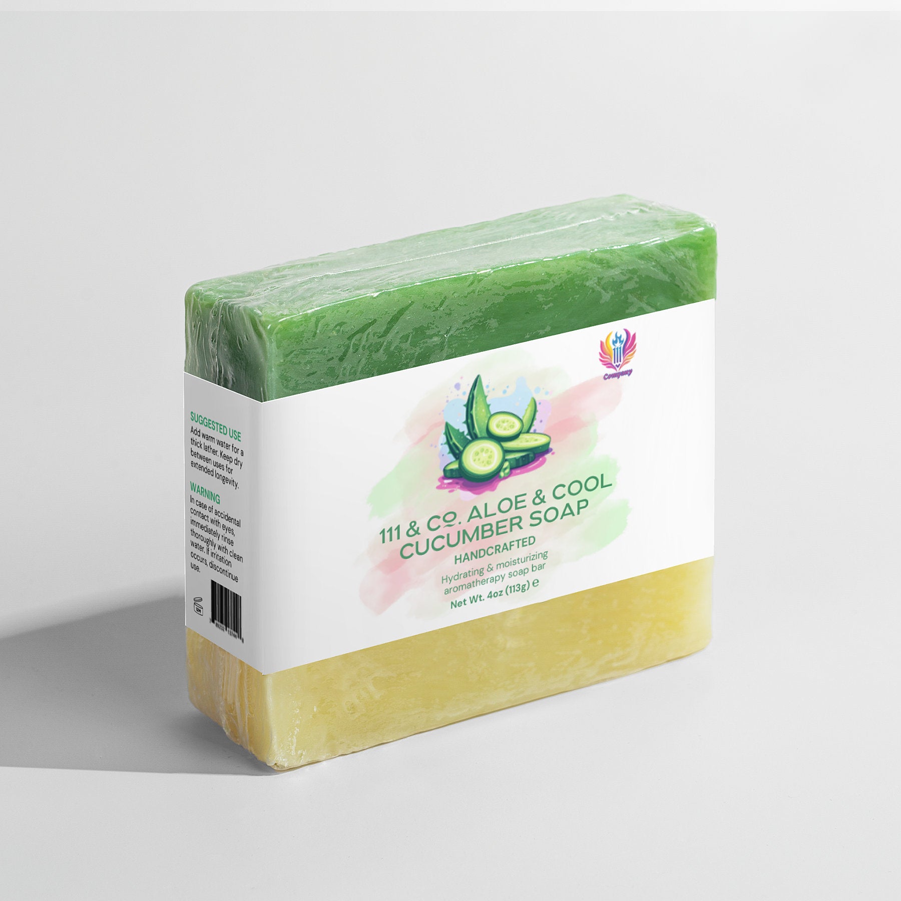 111 & Company Aloe & Cool Cucumber Soap is a handcrafted, dual-layered rectangular bar with green and yellow hues. Ideal for sensitive skin, it hydrates and weighs 4oz (113g). The clear packaging features a cucumber design and side instructions.