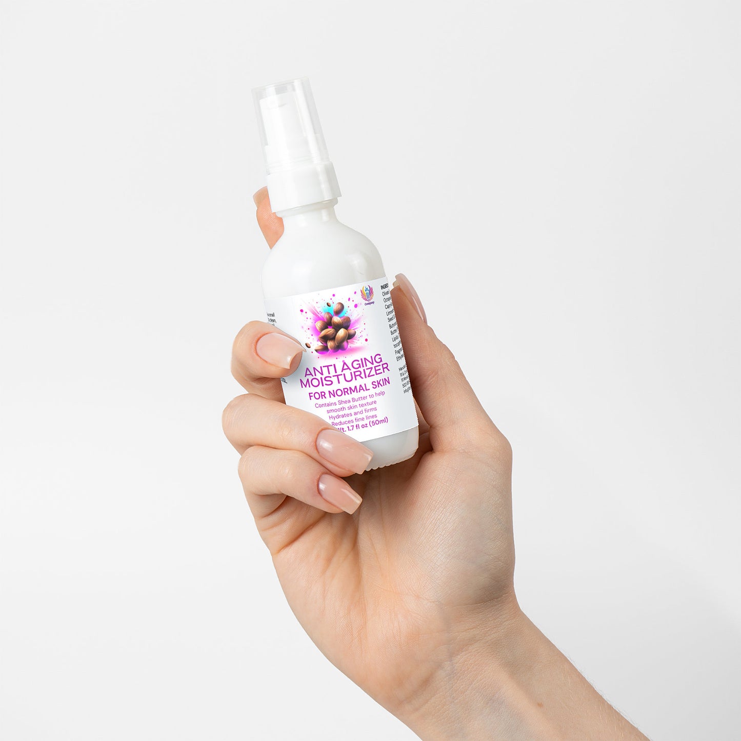 A hand holds a white spray bottle labeled 111 & Co. ANTI AGING MOISTURIZER FOR NORMAL SKIN from 111 & Company, featuring a floral design to enhance collagen for mature skin. The plain background emphasizes the product and manicured nails.