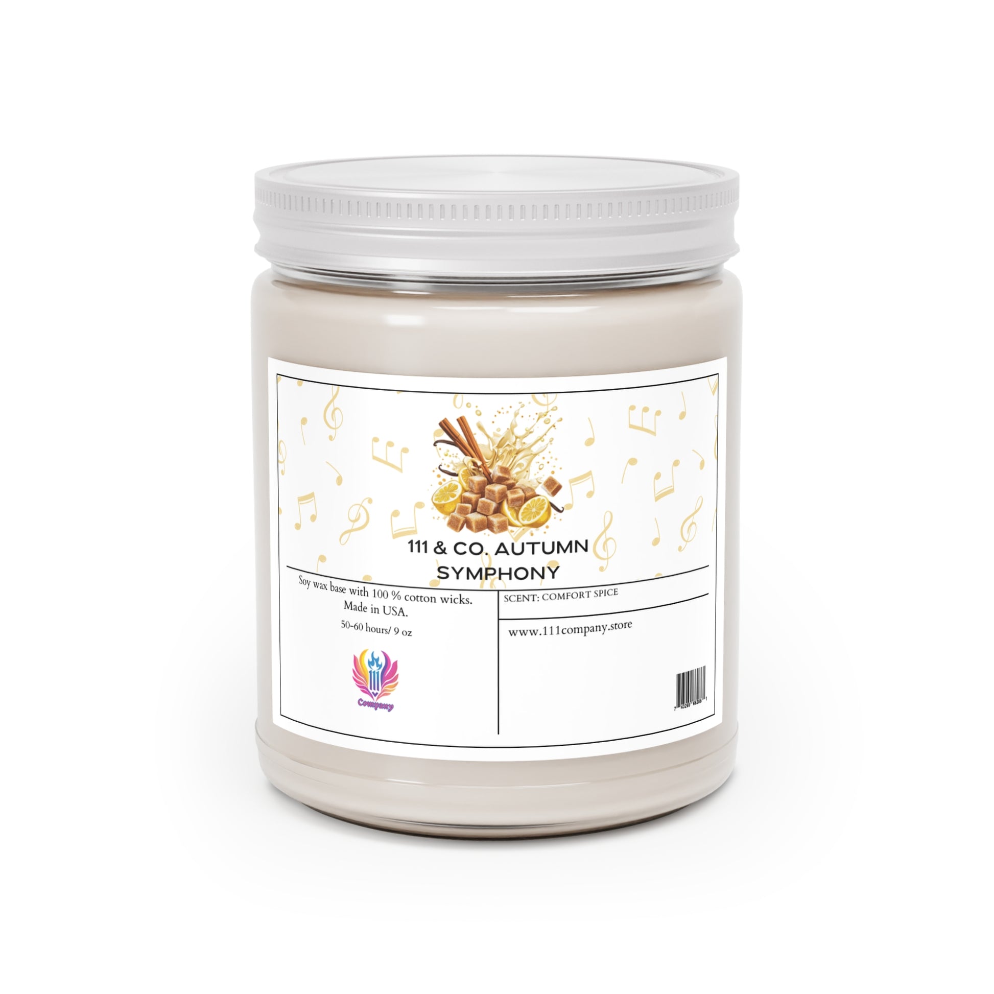 The 111 & COMPANY AUTUMN SYMPHONY COMFORT SPICE candle by 111 & Company features musical notes and cinnamon sticks on a white jar, crafted in the USA with soy wax and a cotton wick for a soothing scent. A website URL is displayed at the bottom on a white background.