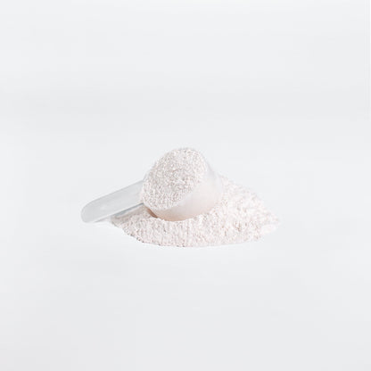 A clear scoop of 111 & COMPANY BCAA POST WORKOUT POWDER (HONEYDEW/WATERMELON) from 111 & Company sits on white powder against a pristine backdrop, highlighting amino acids role in muscle recovery. Soft shadows accentuate the minimalist image.