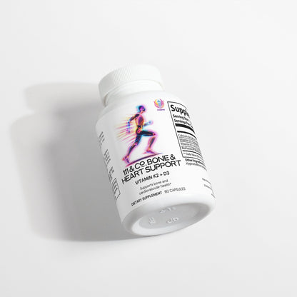 A white bottle of 111 & Company Bone & Heart Support dietary supplements highlights Vitamin K2 and D3 for Bone Health. The label features a colorful running silhouette. Positioned at an angle on a plain white background, the bottle casts a soft shadow.