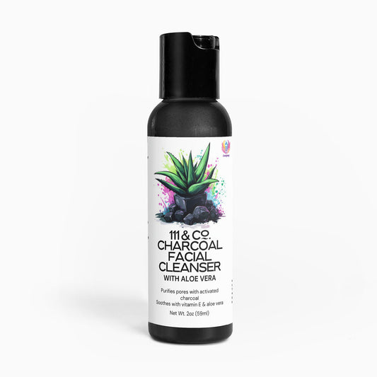 A black 2 oz (56 ml) bottle of 111 & COMPANY CHARCOAL FACIAL CLEANSER by 111 & Company features an aloe plant on charcoal rocks. It highlights natural ingredients like activated charcoal and aloe vera, ideal for daily use.