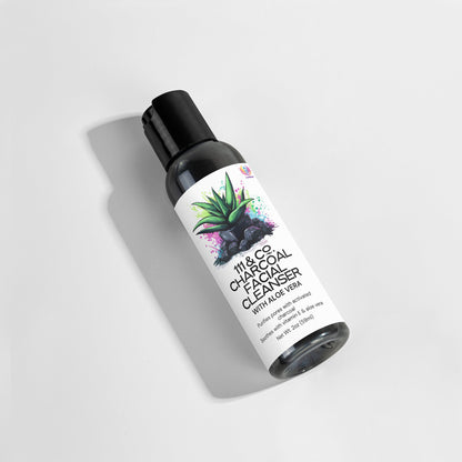The 111 & COMPANY CHARCOAL FACIAL CLEANSER, ideal for daily use, features paraben-free ingredients like Aloe Vera. Its label design showcases an aloe illustration and dark abstract splashes, with the shadow cast left on a white background, highlighting its gray and black tones.
