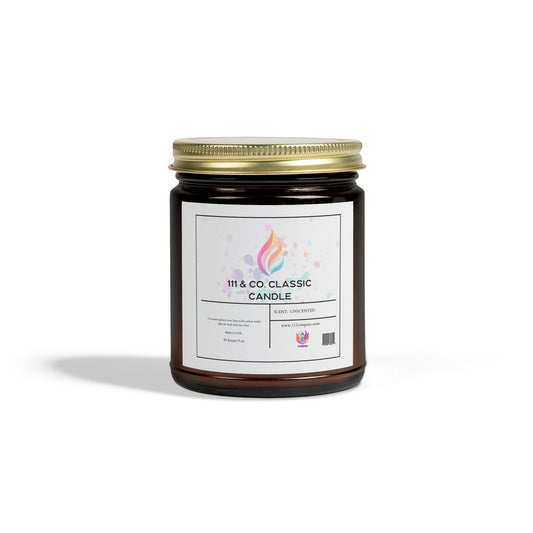 The 111 & Company Classic Unscented Candle features a gold-lidded amber jar with a pastel label showcasing a flame logo. Crafted from eco-friendly coconut apricot wax, its calming glow softly illuminates any white surface. This 9oz candle is perfect for serene environments.
.