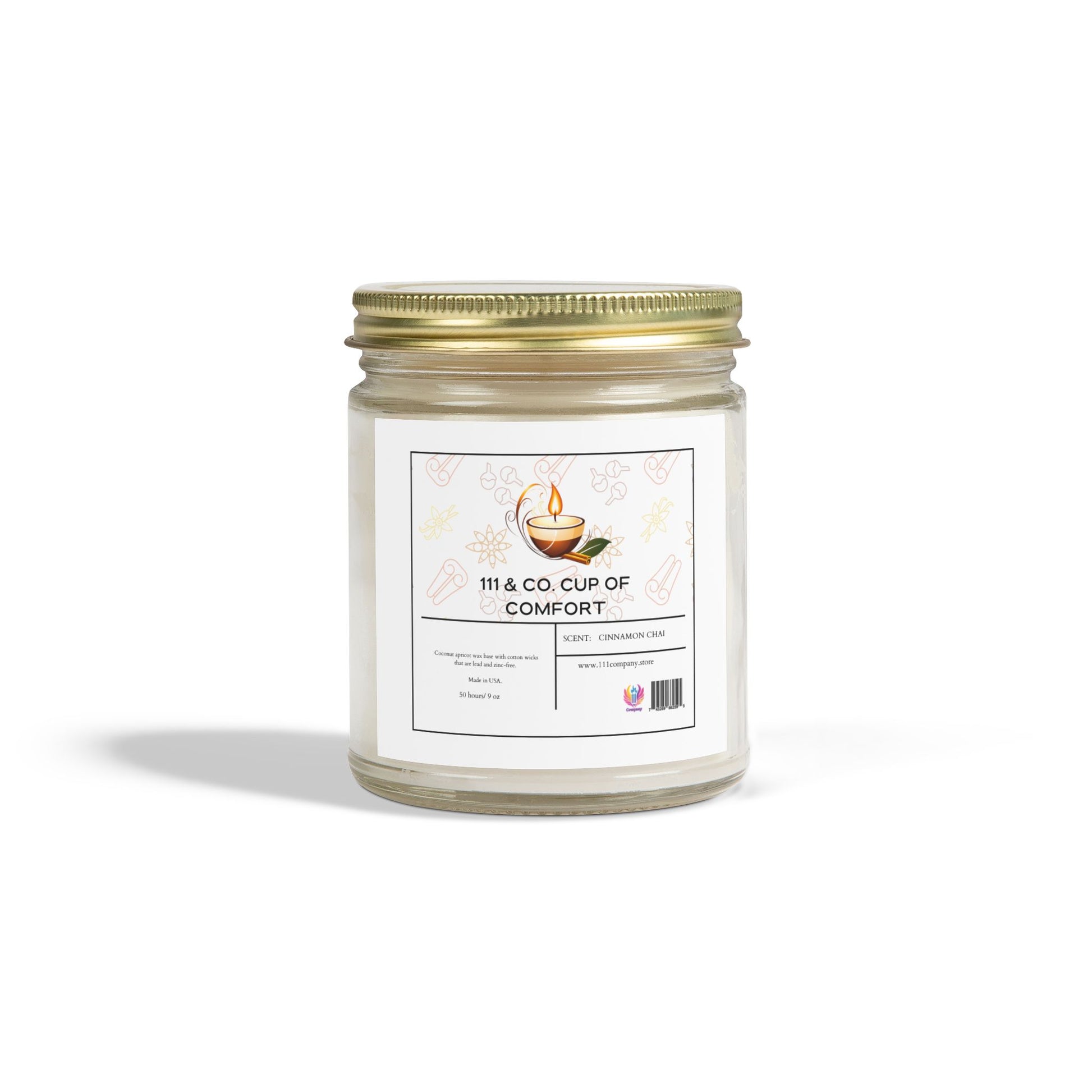The 111 & Company Cup of Comfort candle features cinnamon chai scented coconut apricot wax in a 9oz clear glass jar with a gold lid. The label shows a steaming cup, with decorative leaves and cups as the background.