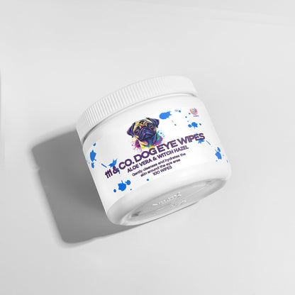 A white container of 111 & Company Dog Eye Wipes rests on a light gray backdrop, featuring a colorful dog illustration and labeled Dog Eye Wipes Aloe Vera & Witch Hazel. It contains 100 wipes for tear stain removal, with natural ingredients. Its shadow is cast to the left.