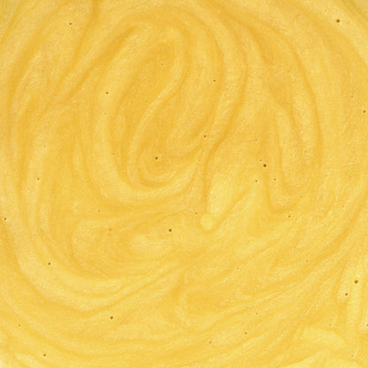 A close-up of 111 & Company Dog Skin Soothing Cream showcases its creamy, vibrant yellow texture with subtle swirls and fine air bubbles. The glossy sheen is enhanced by antioxidant-rich ingredients, giving it a luxurious cream appearance.