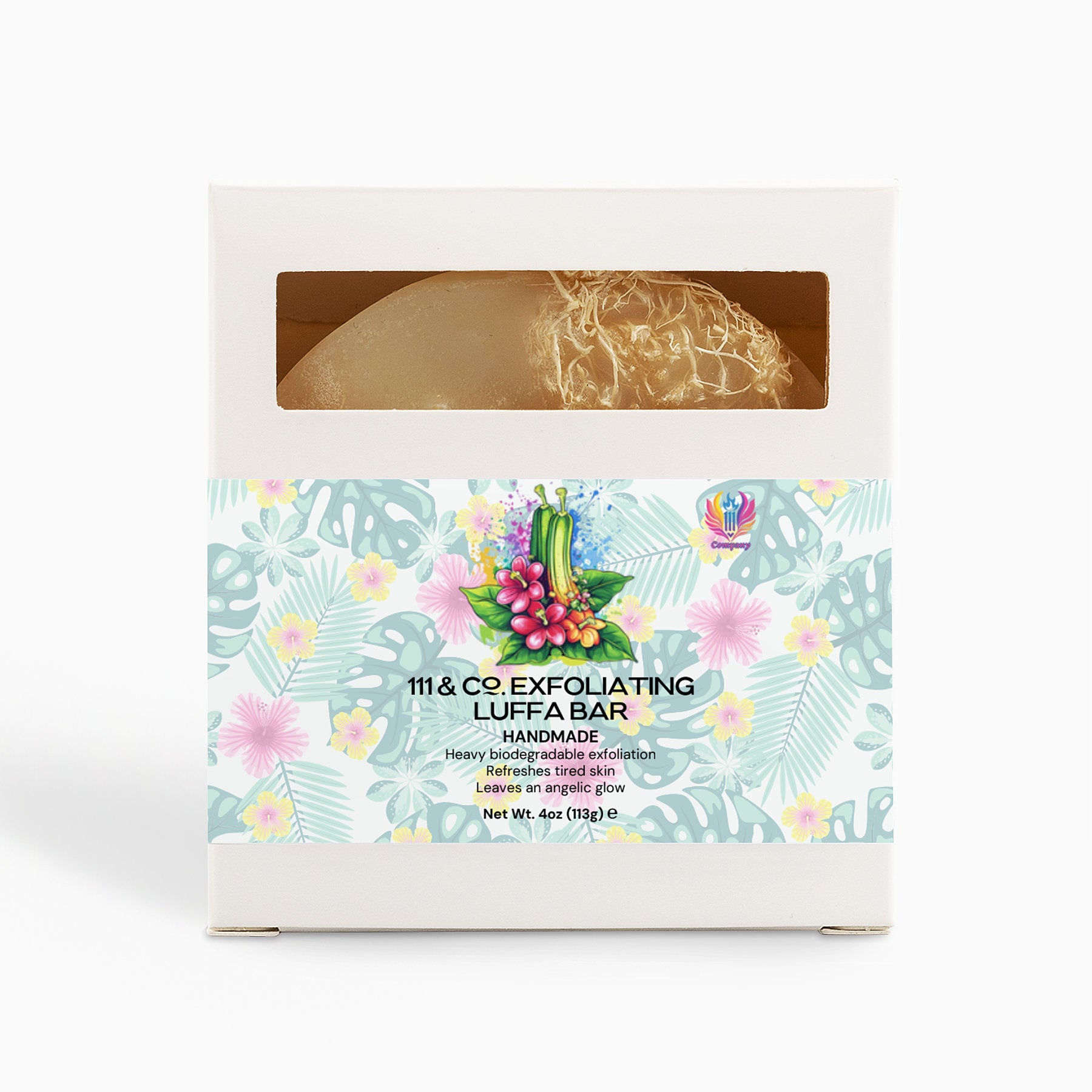 A neatly packaged 111 & Company Exfoliating Luffa Bar with a clear window reveals the soap inside. The box showcases tropical floral patterns, labeled Exfoliating Hemp Bar, Handmade. This biodegradable bar offers a heavy luffa collection for refreshed skin.